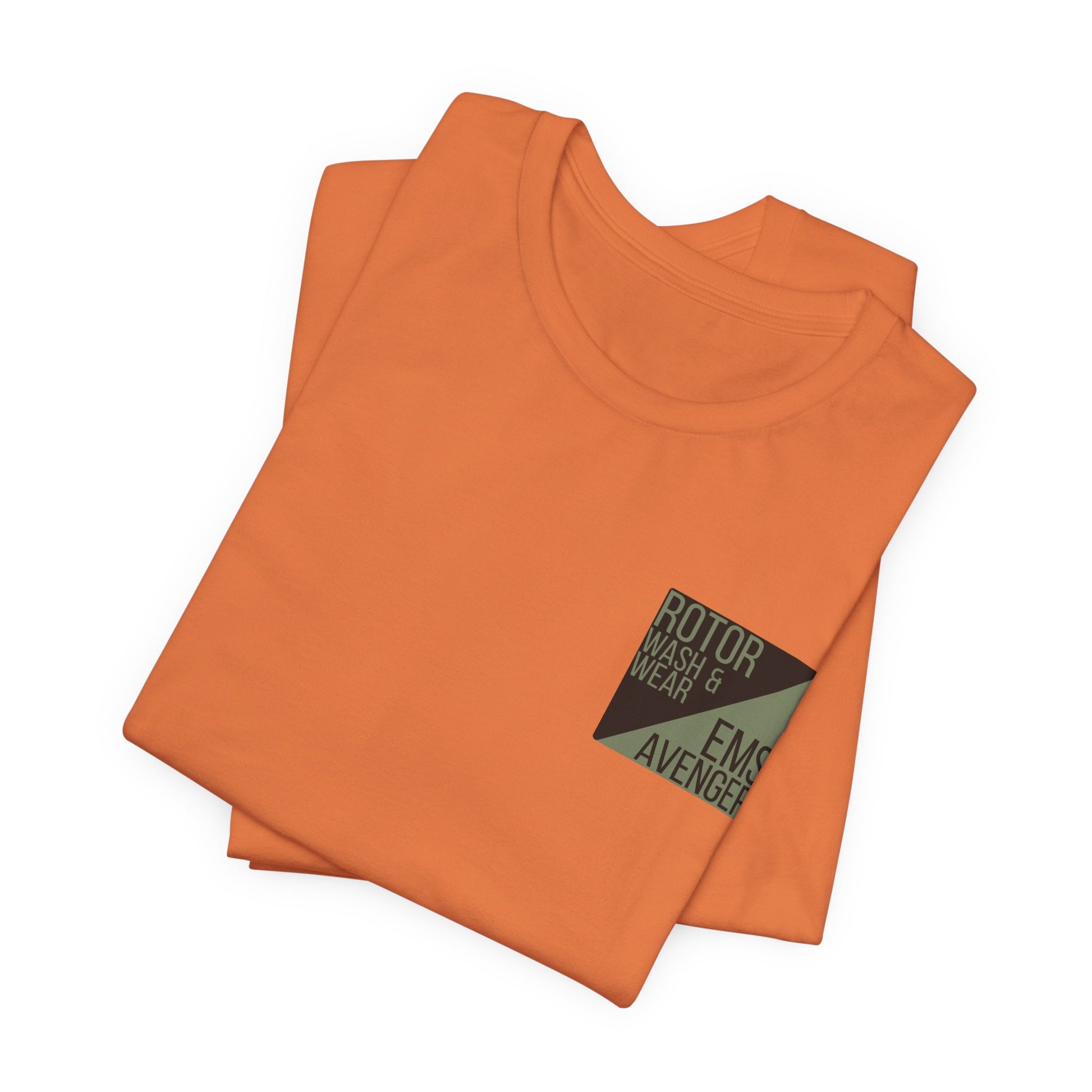Folded orange t-shirt with a logo on the chest of "Rotor Wash & Wear' and "EMS Avenger" against a white background