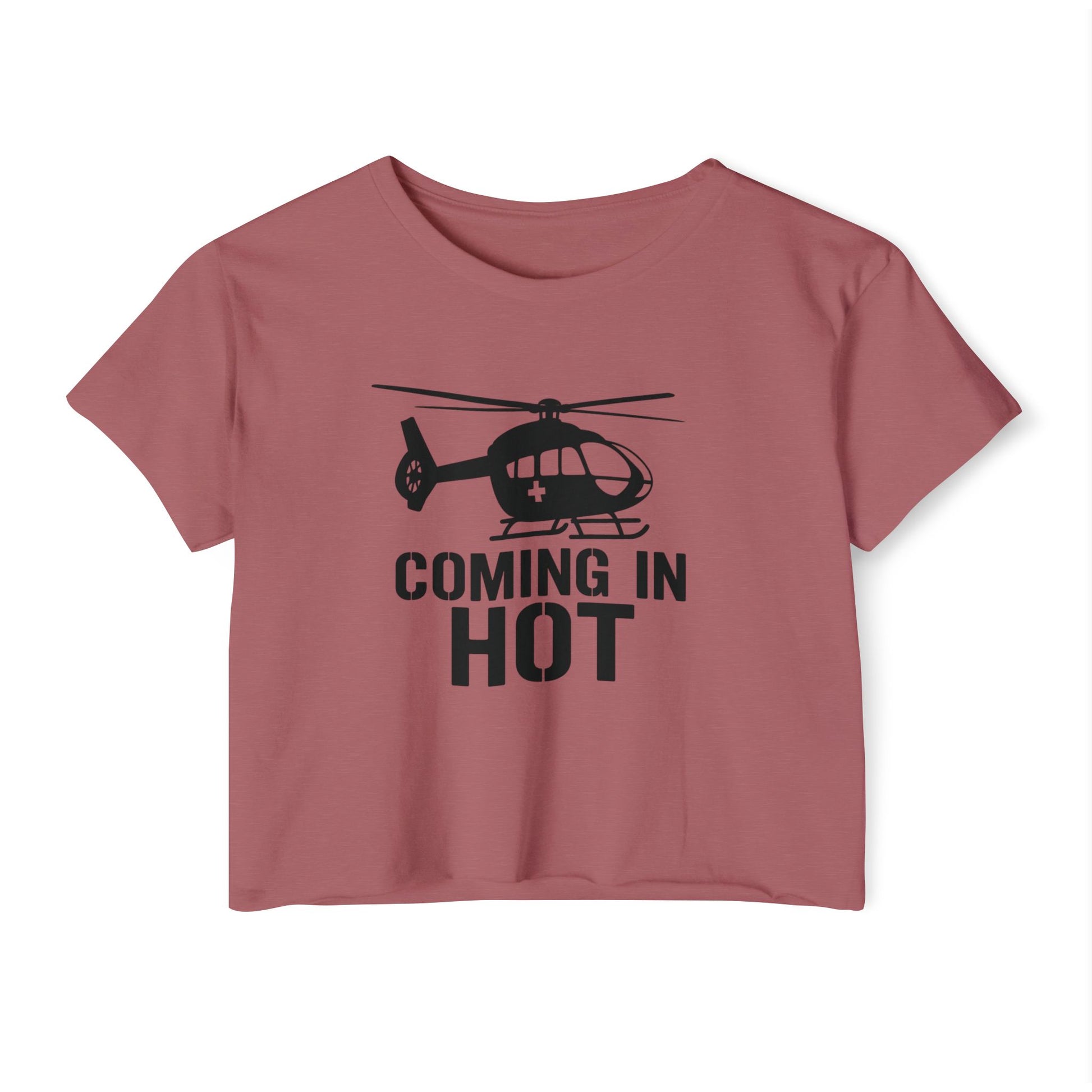 Pink crop top with helicopter graphic and text 'COMING IN HOT' on a white background