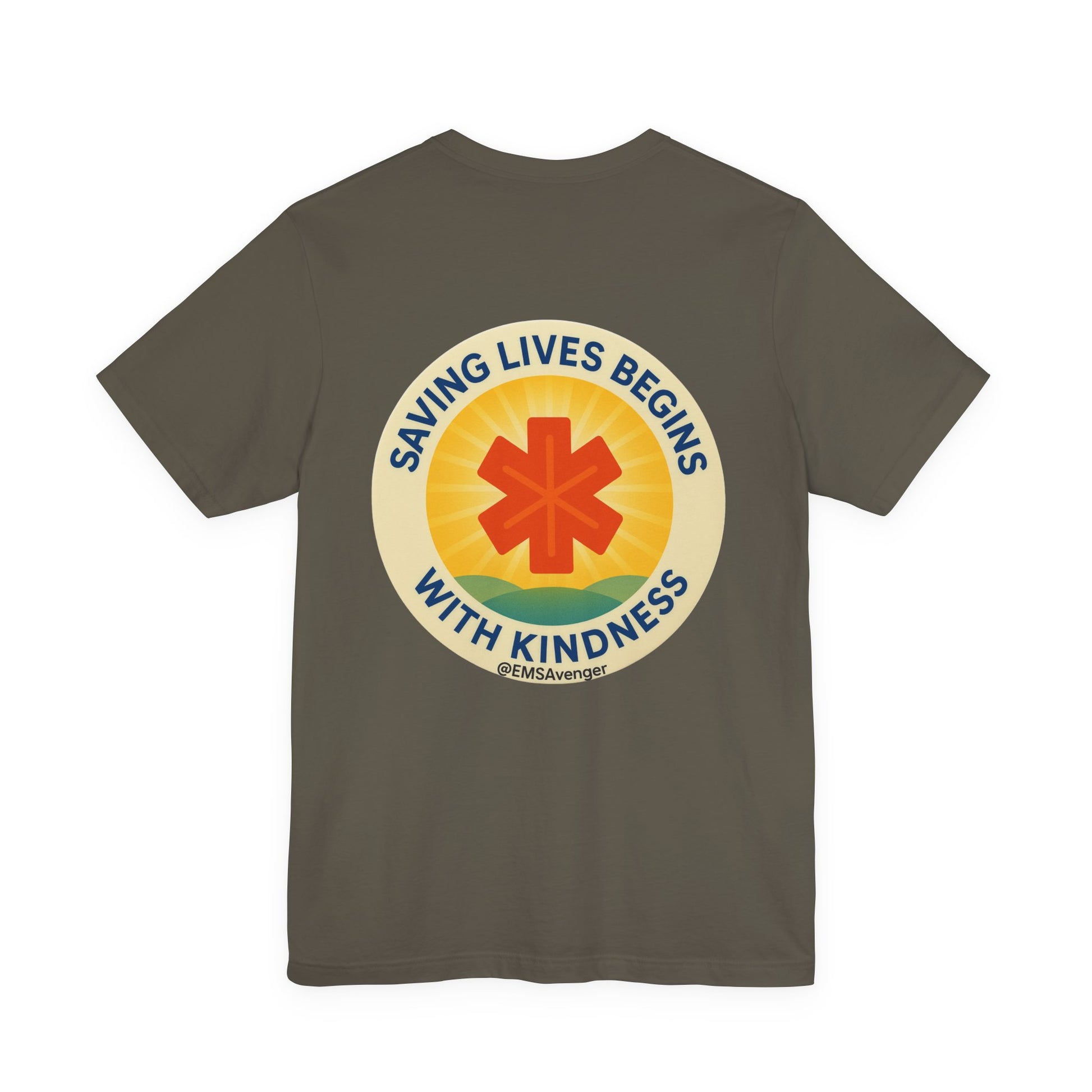 Green t-shirt with a circular design featuring a star of life symbol and text "Saving lives begins with kindness, EMS Avenger" on the back, on a white background.
