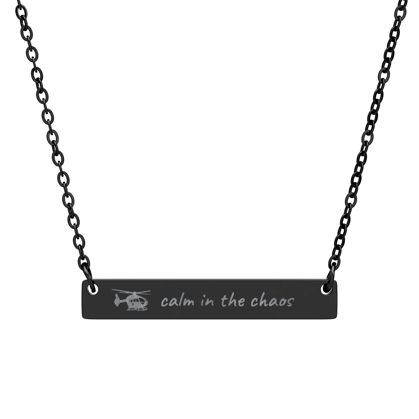 Black necklace with engraved bar with helicopter symbol and text "calm in the chaos" by Rotor Wash & Wear