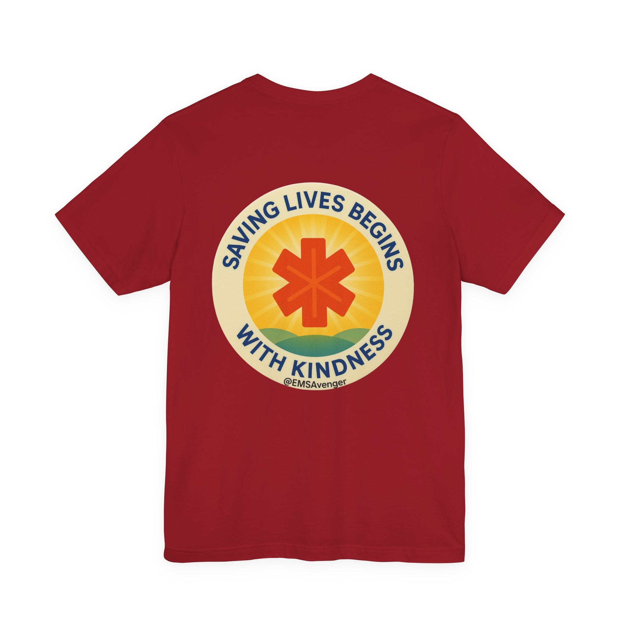 Red t-shirt with a circular design featuring a star of life symbol and text "Saving lives begins with kindness, EMS Avenger" on the back, on a white background.