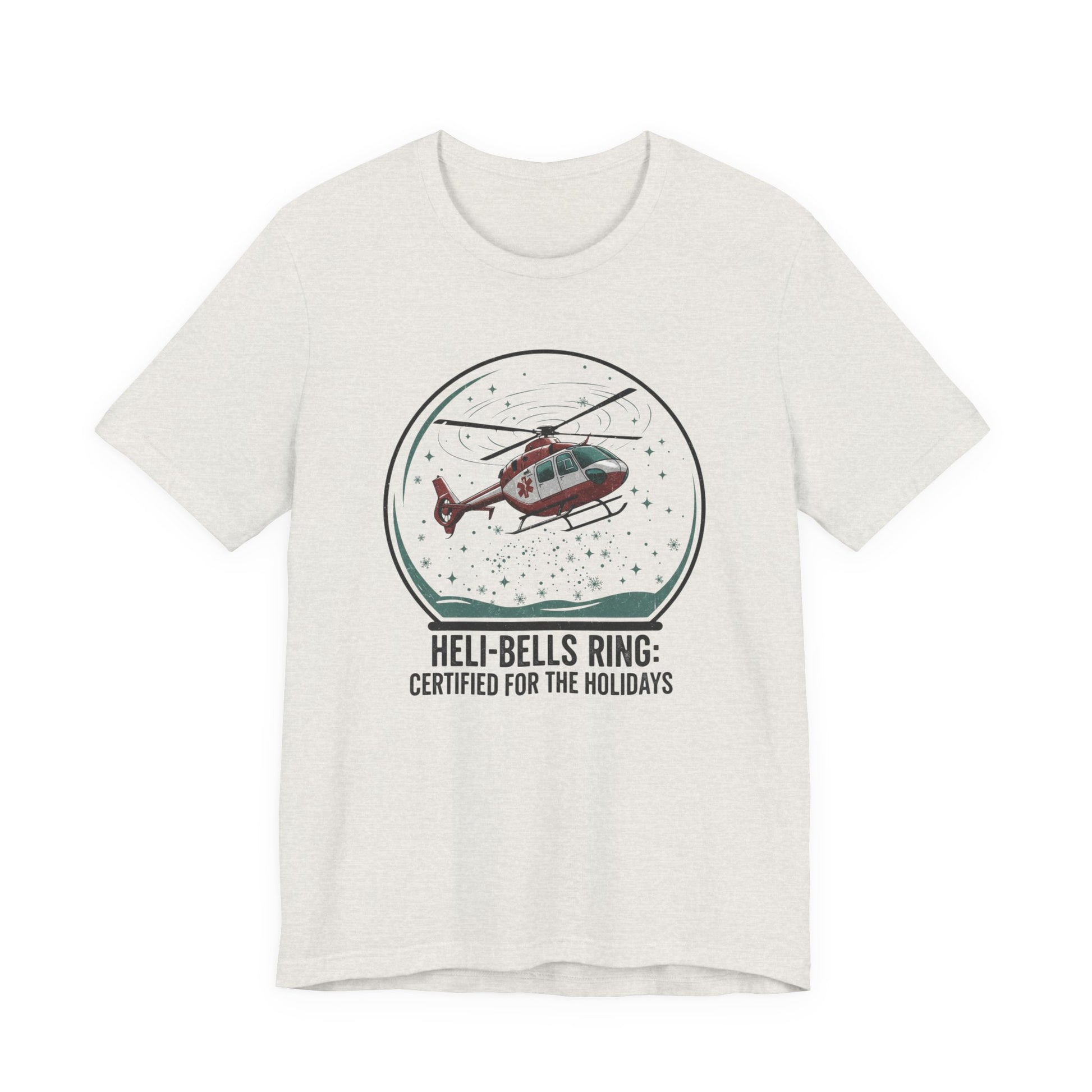 Heather cement t-shirt with a graphic of a helicopter in a snow globe and text "Heli-bells ring: certified for the holidays" by Rotor Wash & Wear