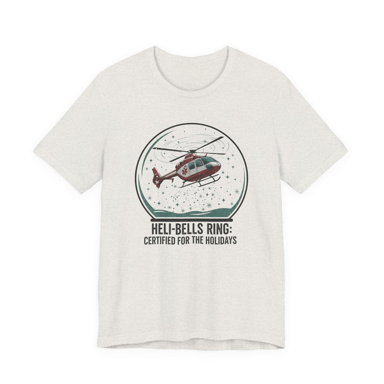 Heather cement t-shirt with a graphic of a helicopter in a snow globe and text "Heli-bells ring: certified for the holidays" by Rotor Wash & Wear