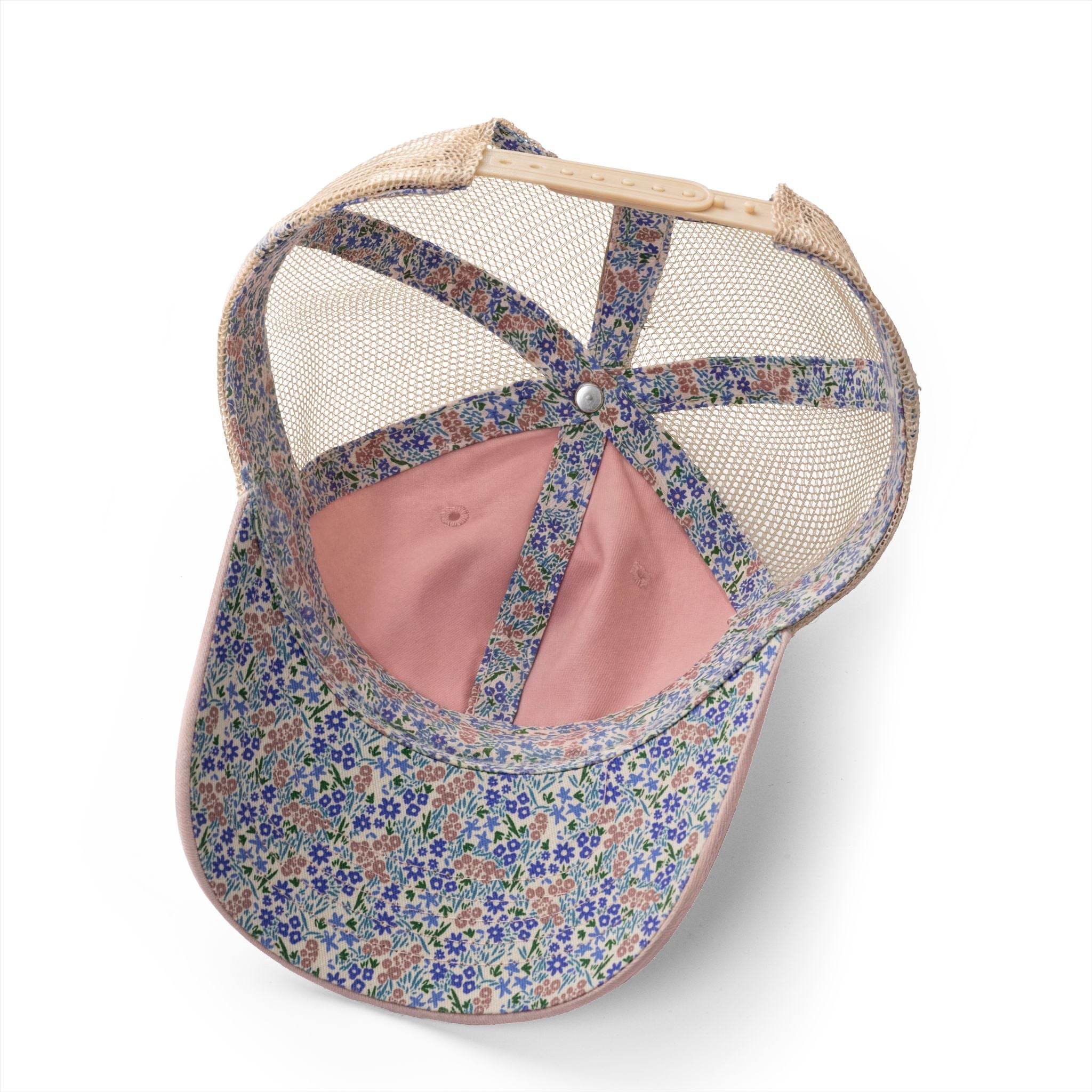 Floral-patterned cap interior with mesh back on a white background