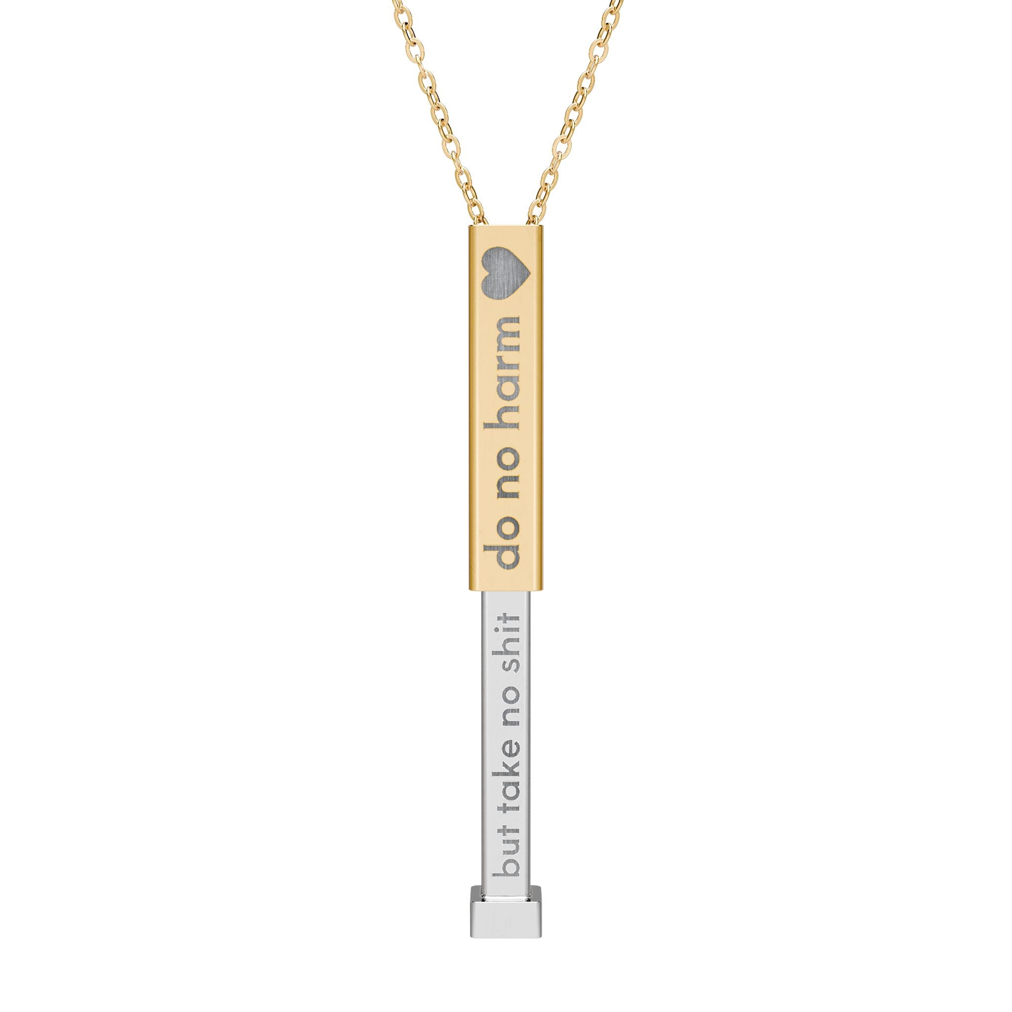 Silver and gold two-toned necklace with a cylindrical pendant engraved with 'do no harm' with interior engraving "but take no shit" by Rotor Wash & Wear