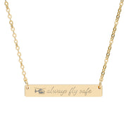 Gold necklace with a medical helicopter and 'always fly safe' engraving on a white background