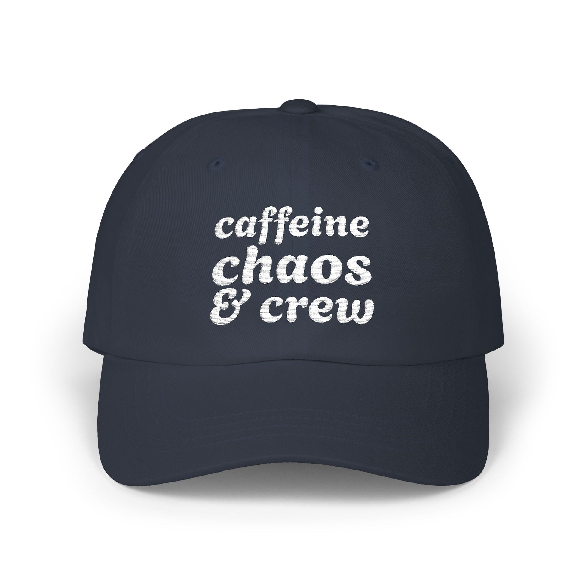 Navy blue cap with 'cafeine chaos & crew' text on a white background