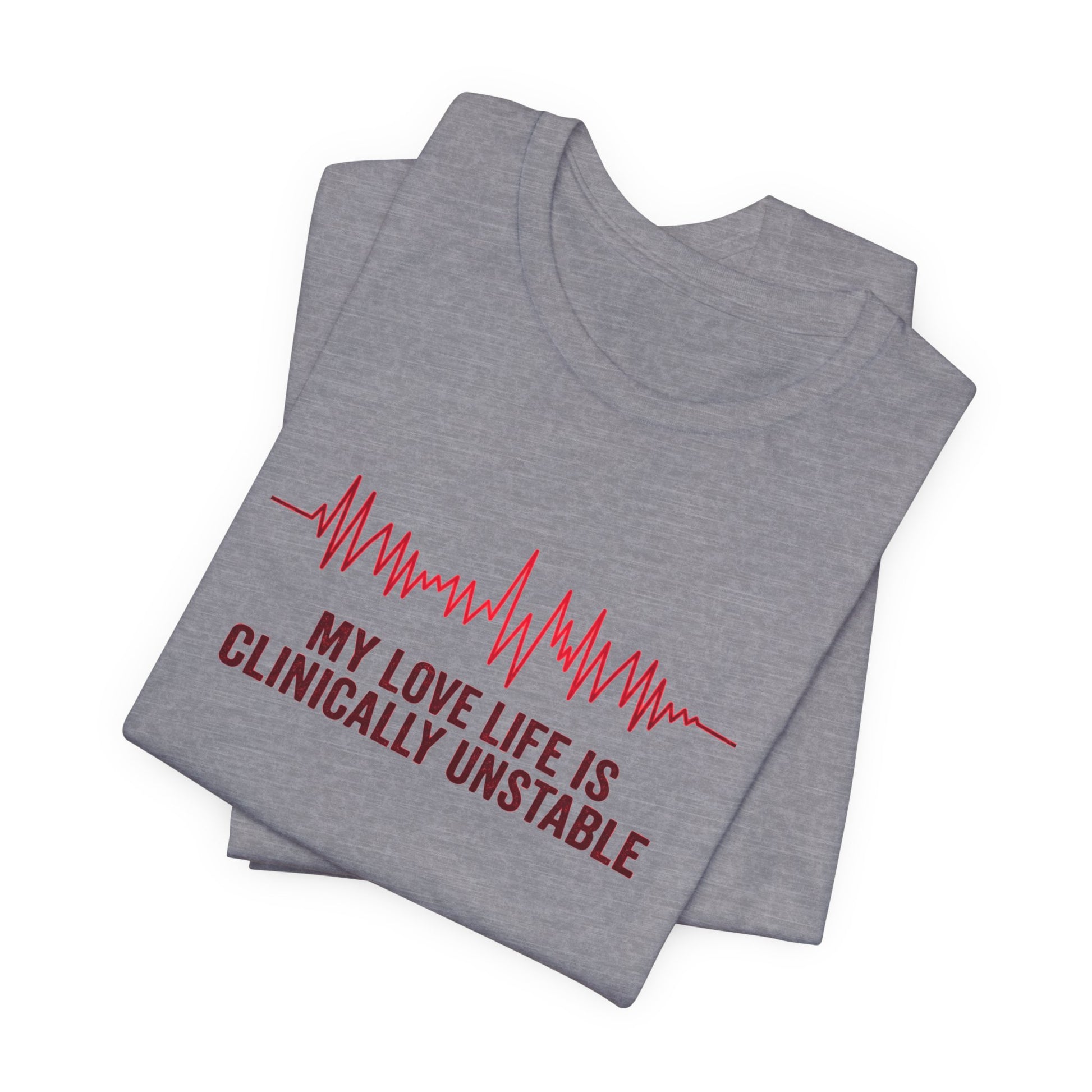 Folded gray t-shirt ventricular fibrillation cardiac rhythm and text "My love life is clinically unstable" by Rotor Wash & Wear