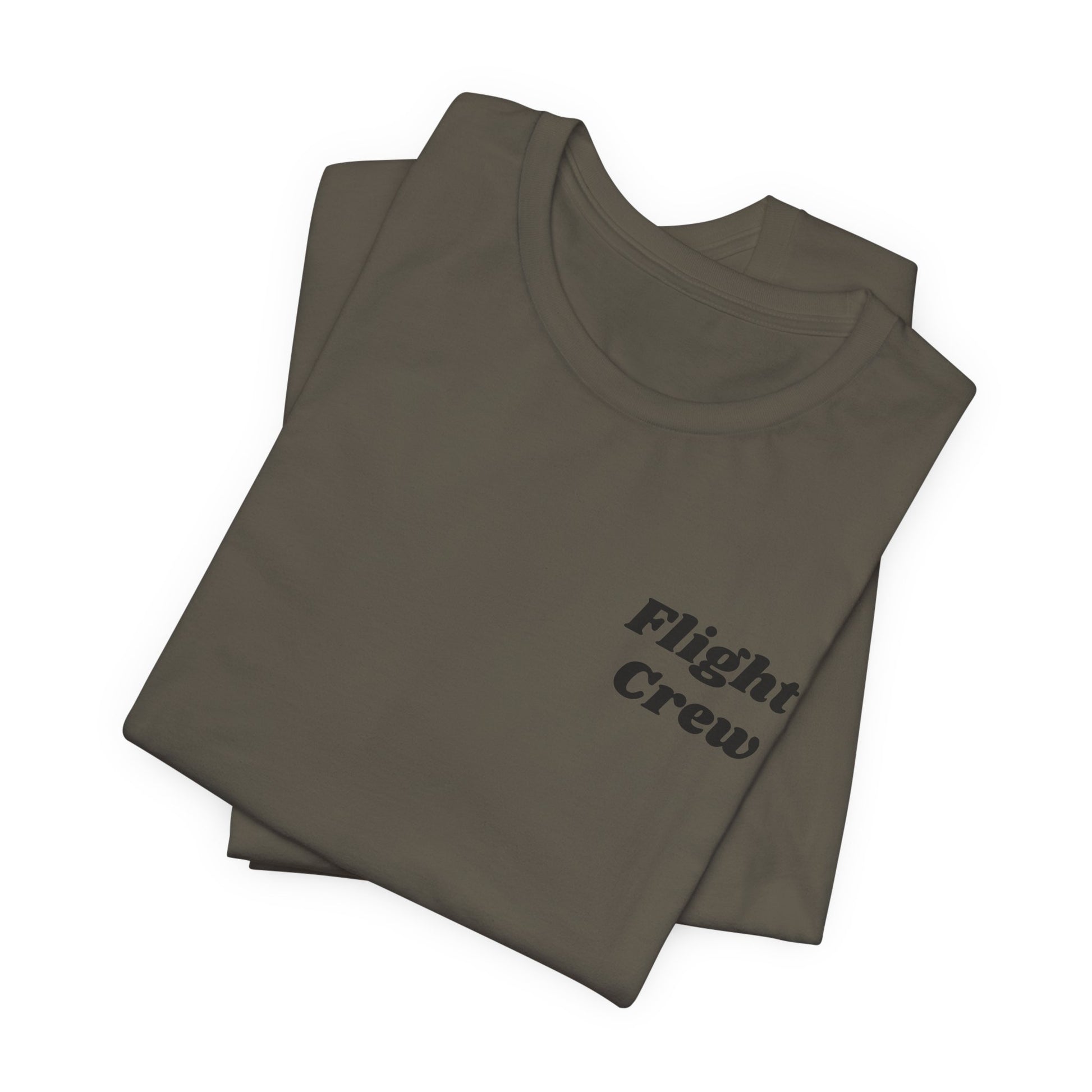 Folded army green t-shirt with 'Flight Crew' text on a white background