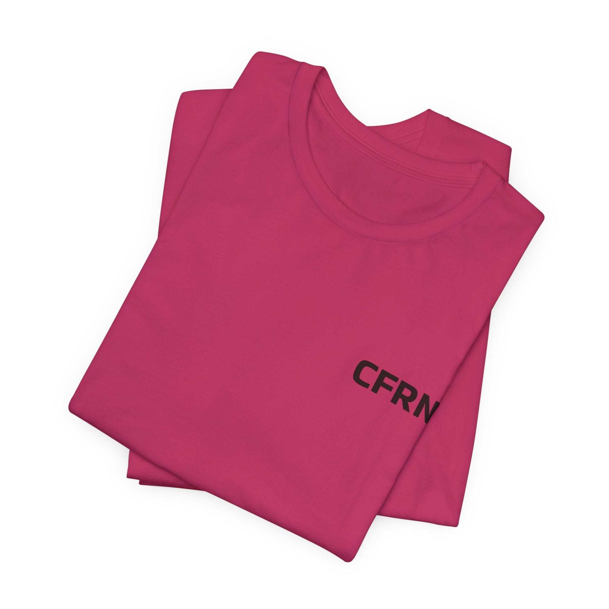 Folded pink t-shirt with 'CFRN' text on a white background