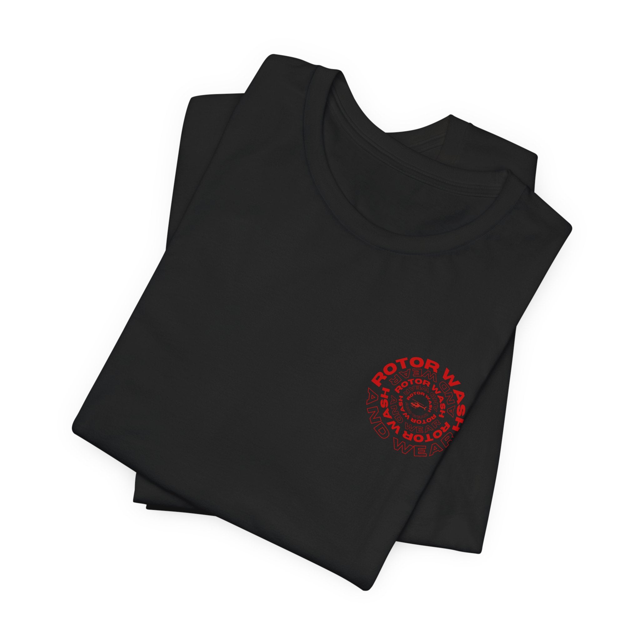 Folded black t-shirt with 'Rotor Wash and Wear' circular design text design on the left chest on a white background