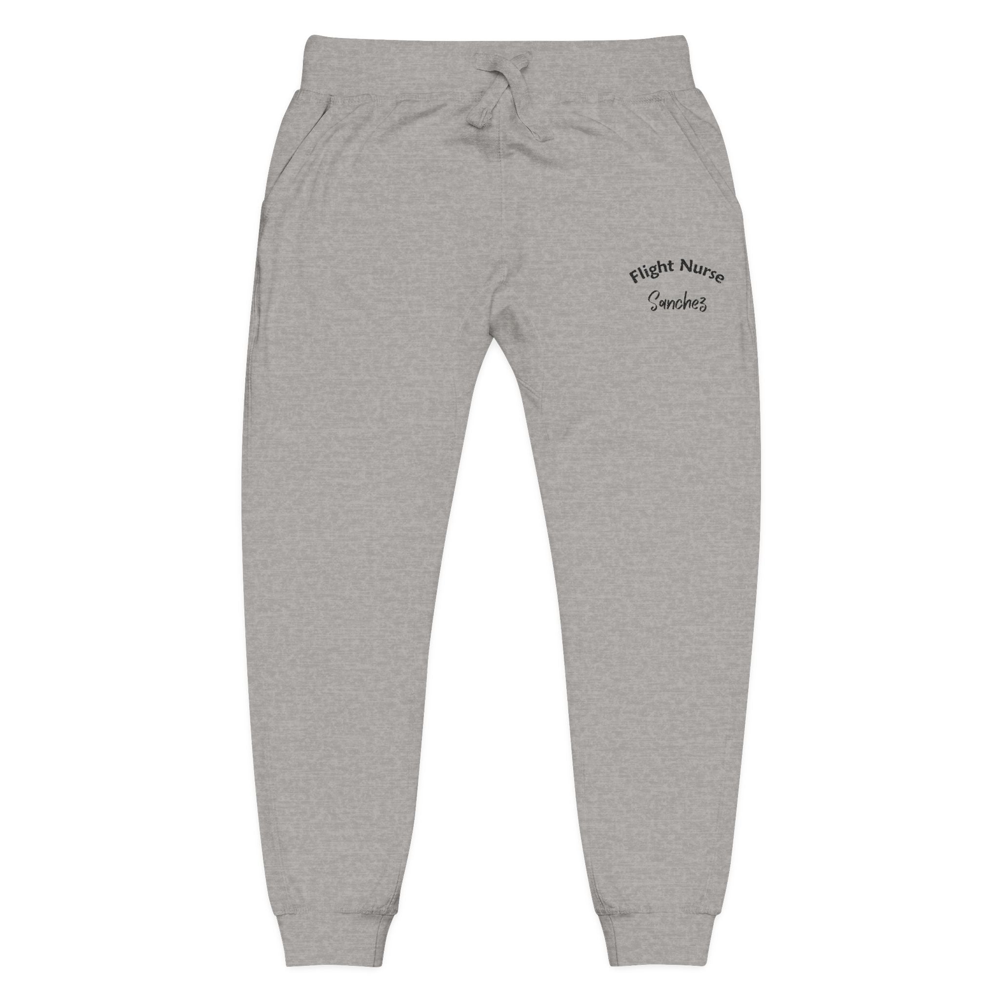 Gray joggers with embroidered 'Flight Nurse Sanchez' text on the thigh against a white background