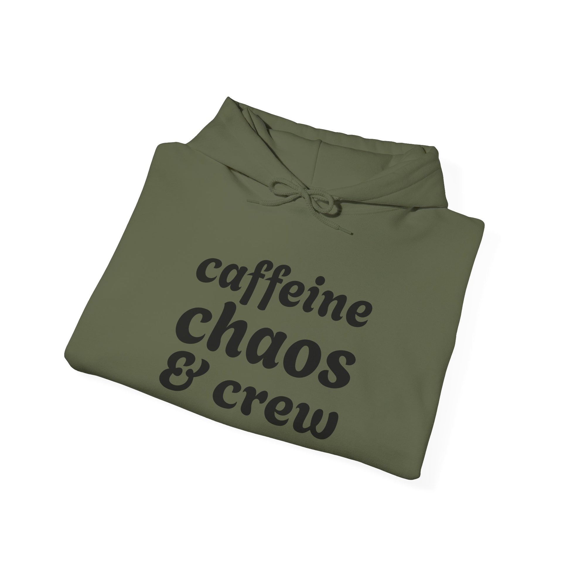 Folded green hoodie with 'caffeine chaos & crew' text on a white background