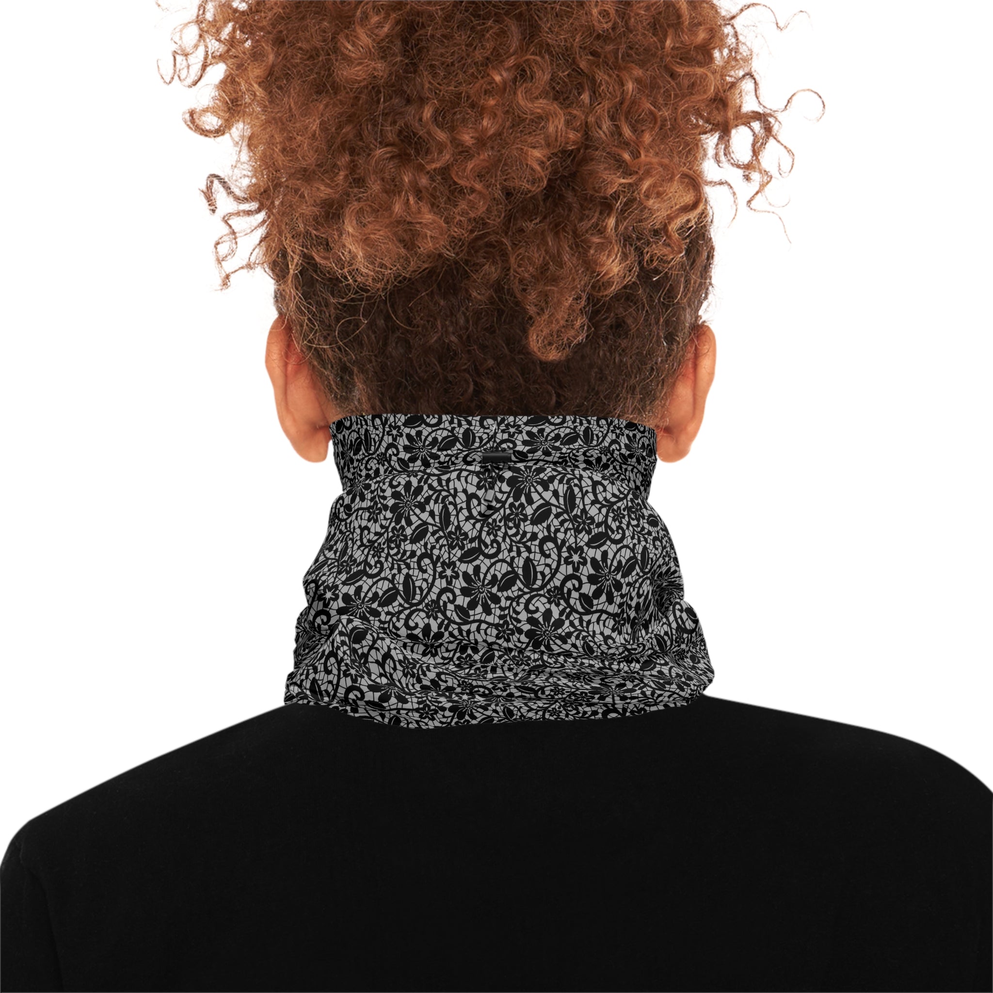 Person wearing a black and gray lace patterned neck gaiter by Rotor Wash & Wear