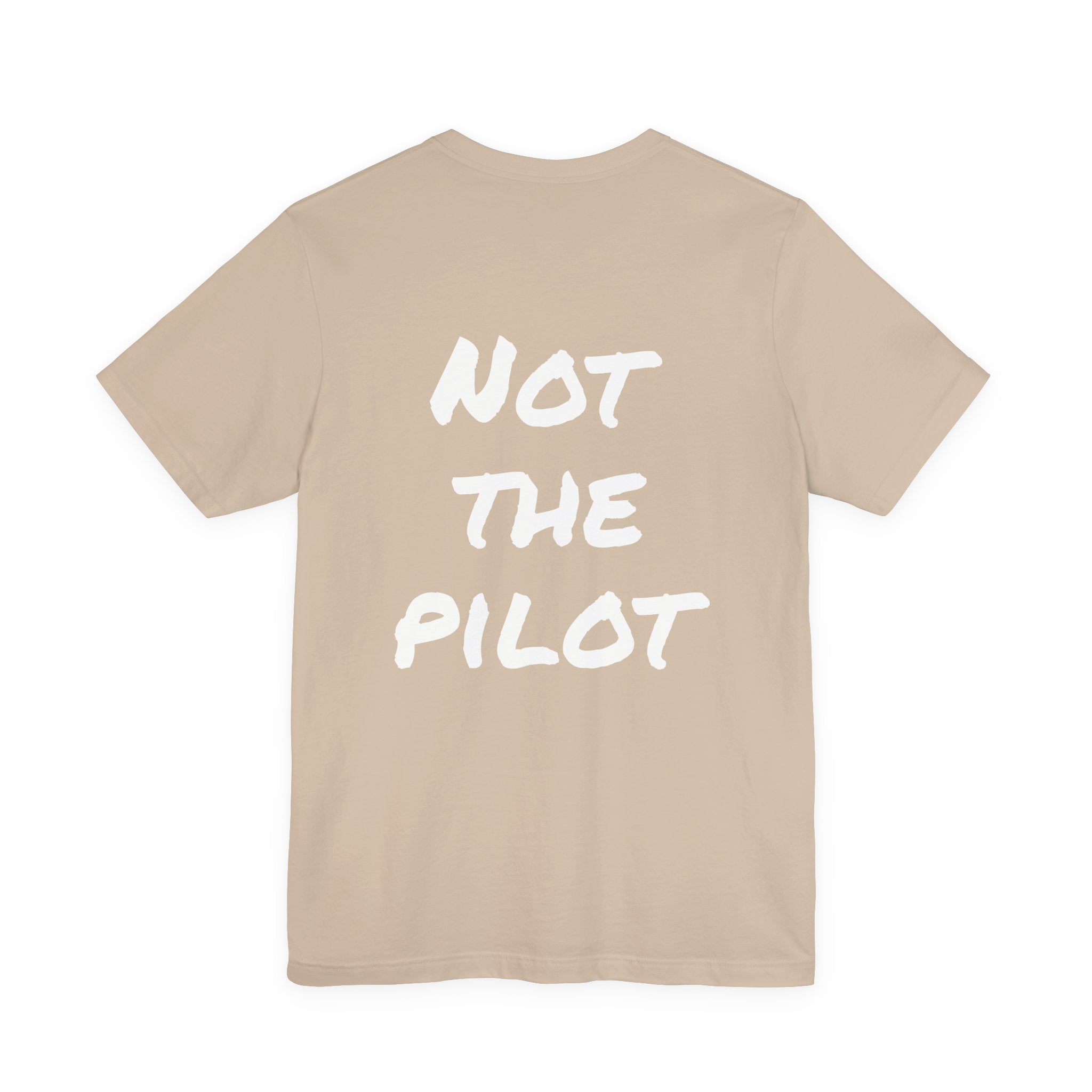 Beige t-shirt with 'NOT THE PILOT' text on a white background