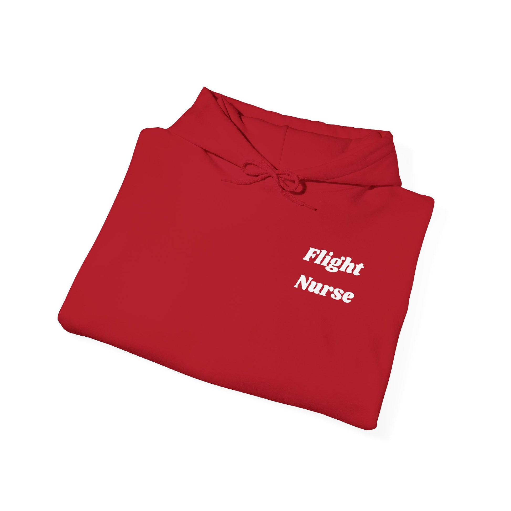Folded red shirt with 'Flight Nurse' text on a white background