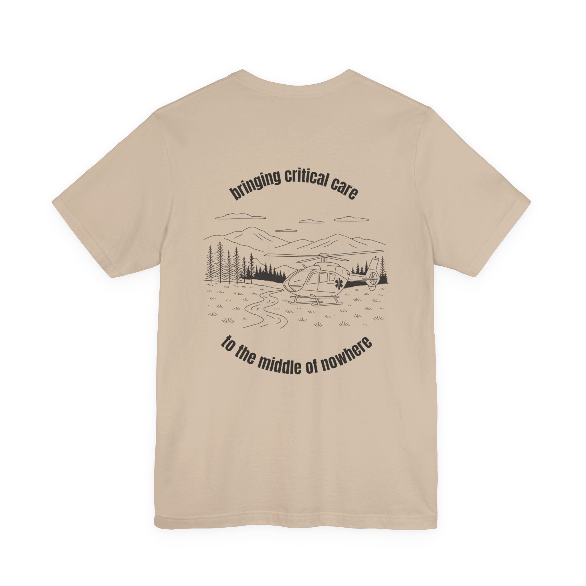 Beige t-shirt with a helicopter graphic and text &quot;bringing critical care to the middle of nowhere&quot; on the back, displayed on a white background.