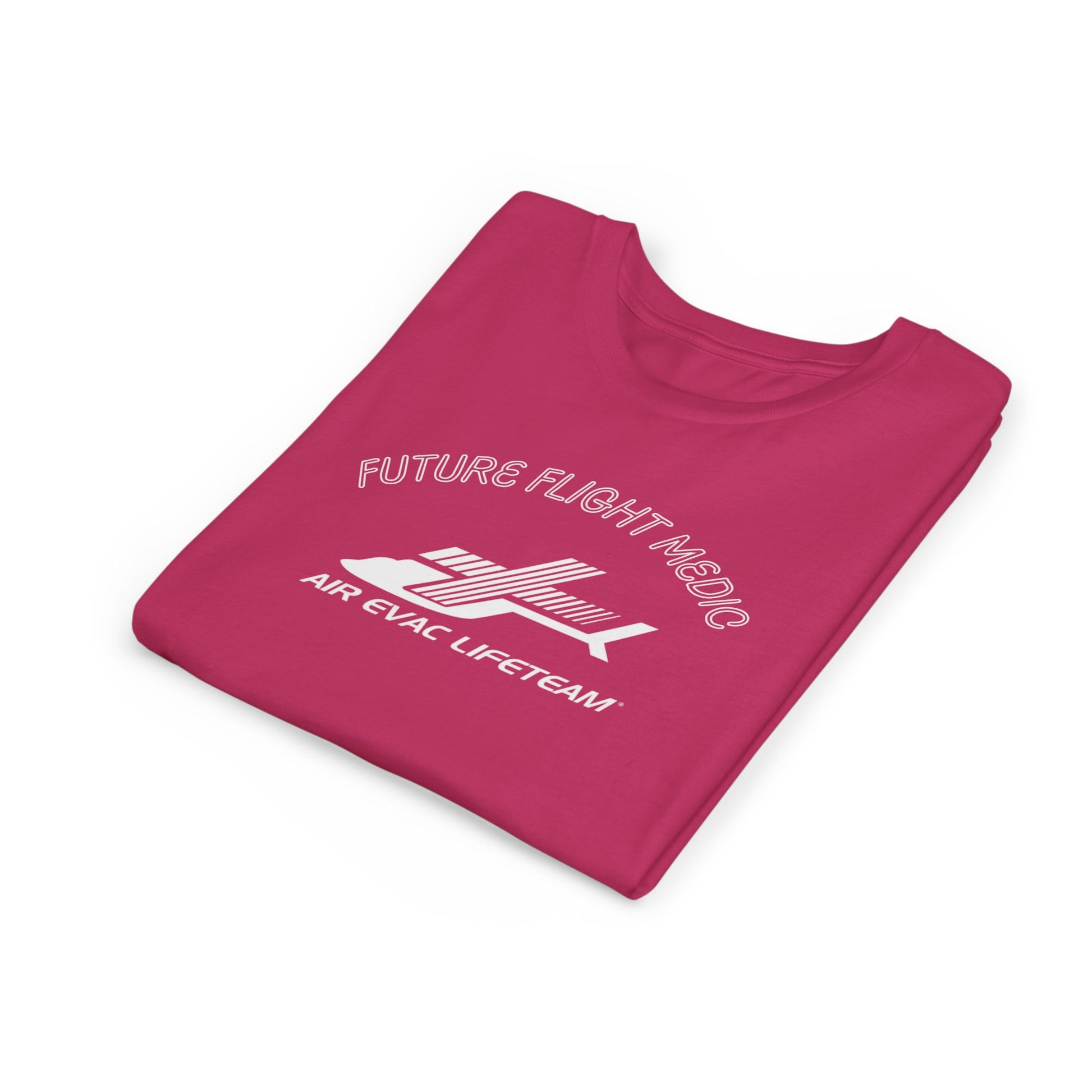 Folded pink kid's t-shirt with Air Evac Lifeteam logo and text "Future Flight Medic" by Rotor Wash & Wear