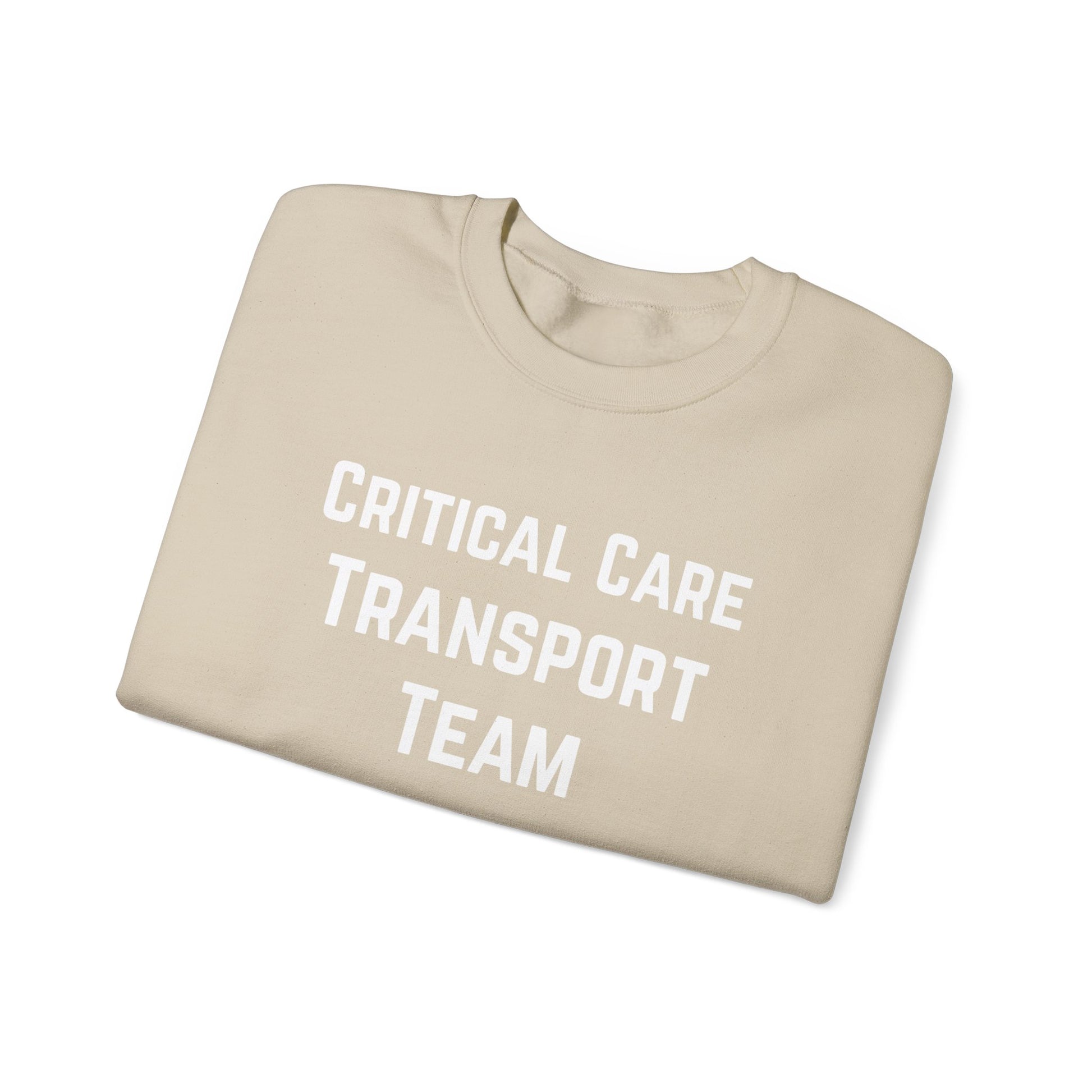 Folded beige sweatshirt with 'Critical Care Transport Team' text by Rotor Wash & Wear