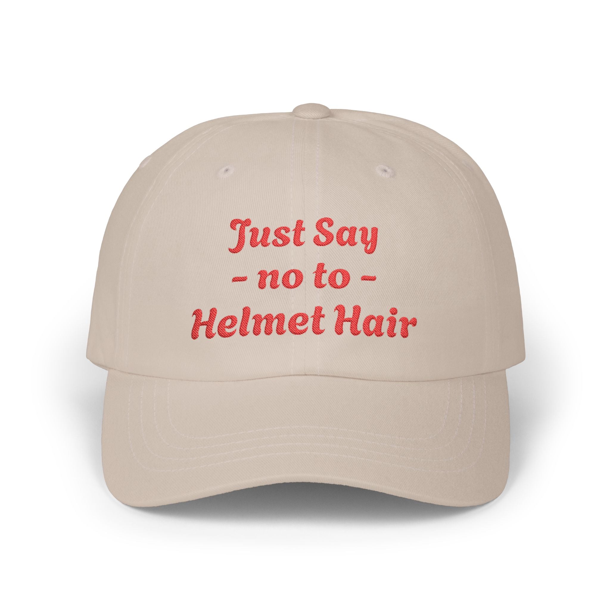 Beige cap with red text 'Just Say no to Helmet Hair' on a white background
