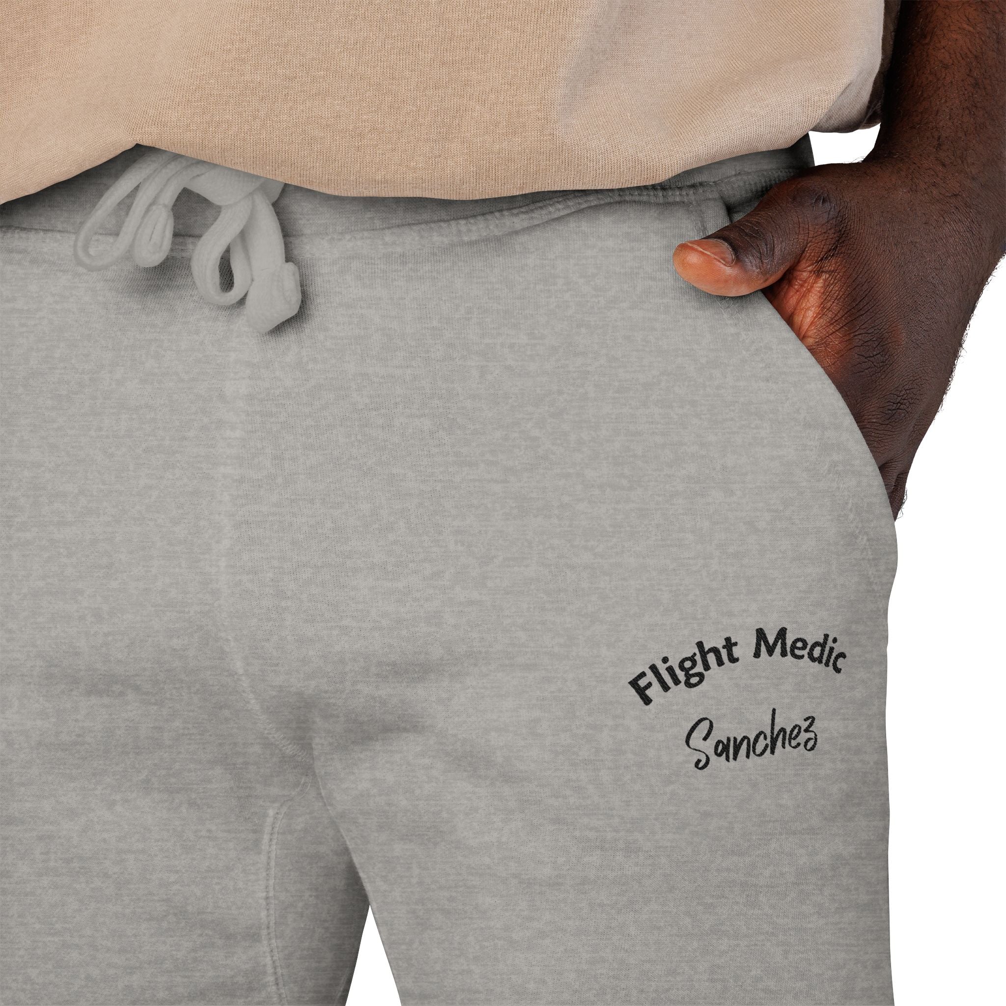 Gray joggers with text "Flight Medic Sanchez" on a white background