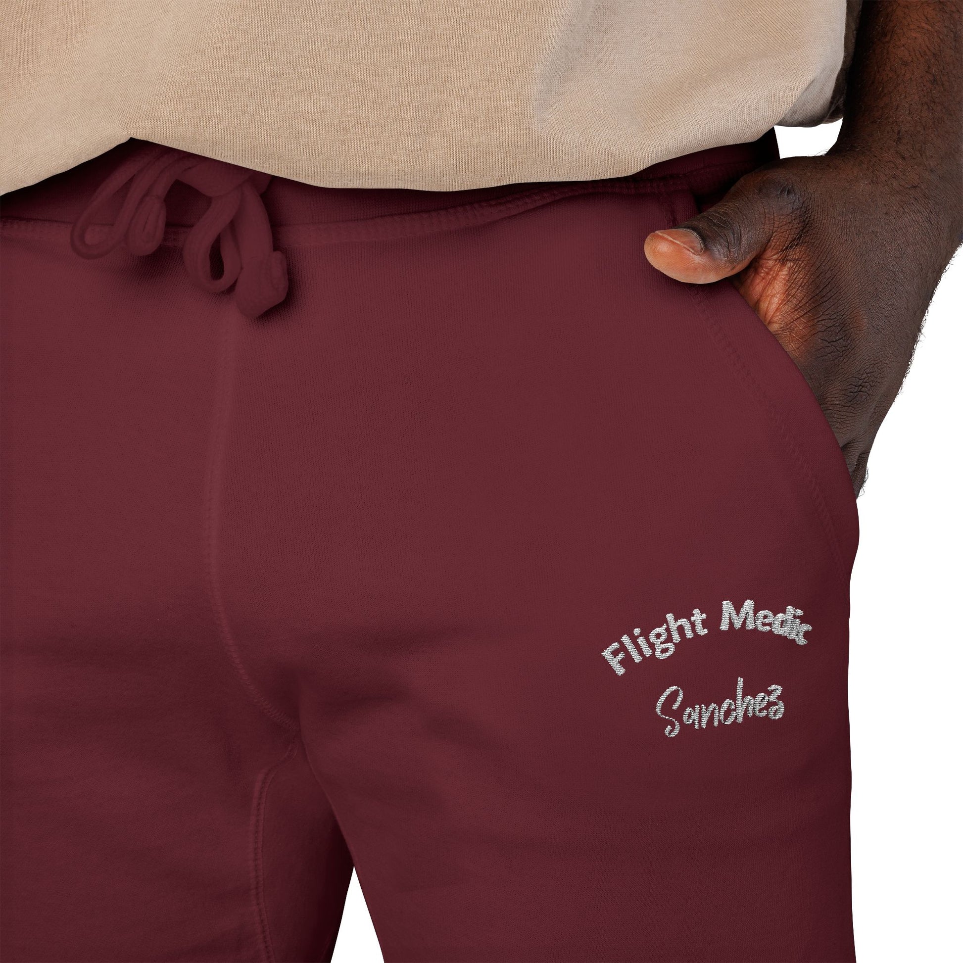 Maroon joggers with text "Flight Medic Sanchez" on a white background