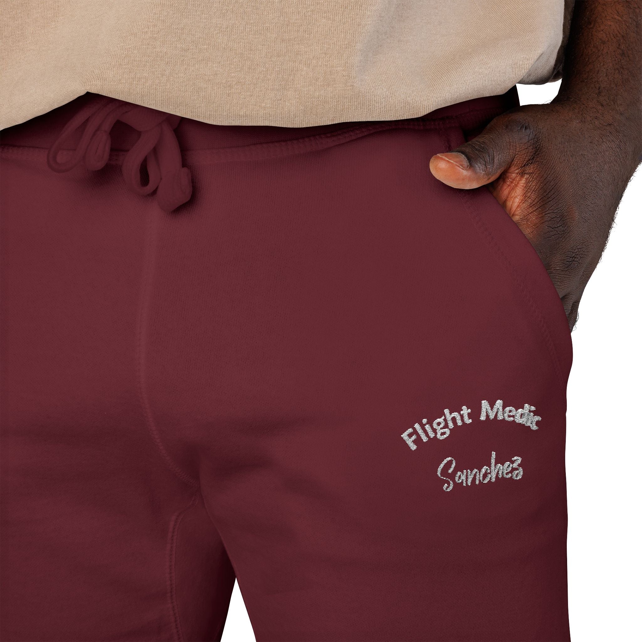 Maroon joggers with text "Flight Medic Sanchez" on a white background