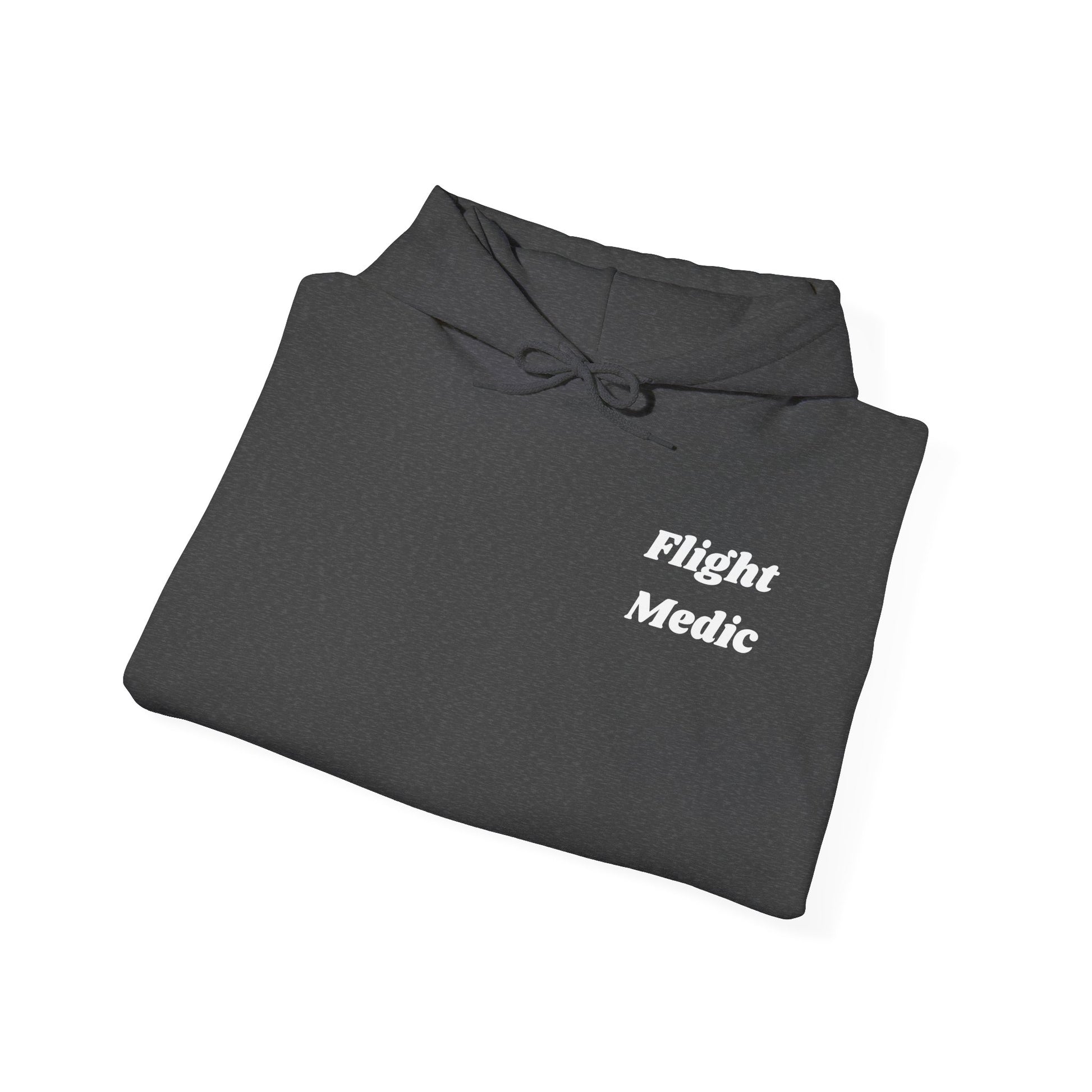 Folded dark gray hoodie with 'Flight Medic' text on a white background