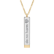 Silver and gold two-toned necklace with a cylindrical pendant engraved with 'do no harm' with interior engraving "but take no shit" by Rotor Wash & Wear