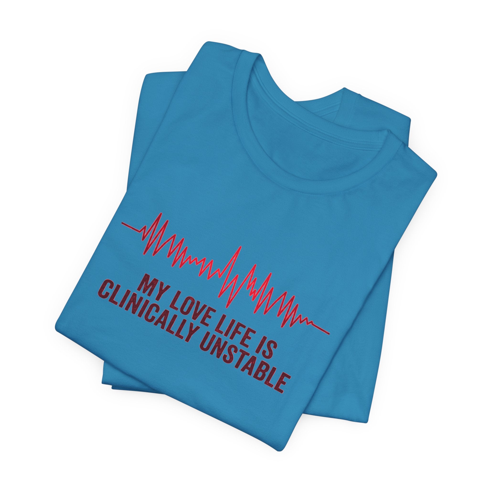 Folded turquoise t-shirt ventricular fibrillation cardiac rhythm and text "My love life is clinically unstable" by Rotor Wash & Wear