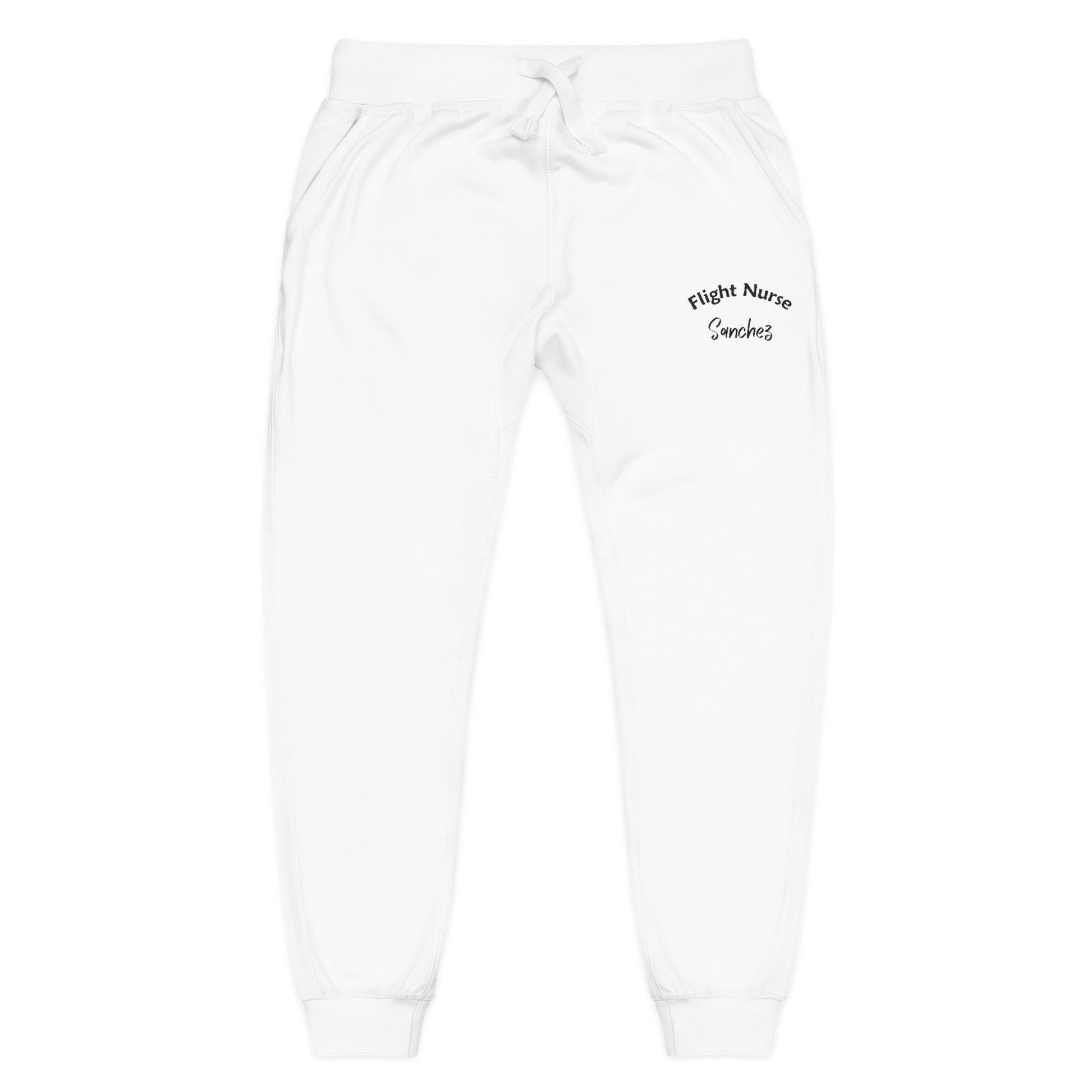 White joggers with embroidered 'Flight Nurse Sanchez' text on the thigh against a white background