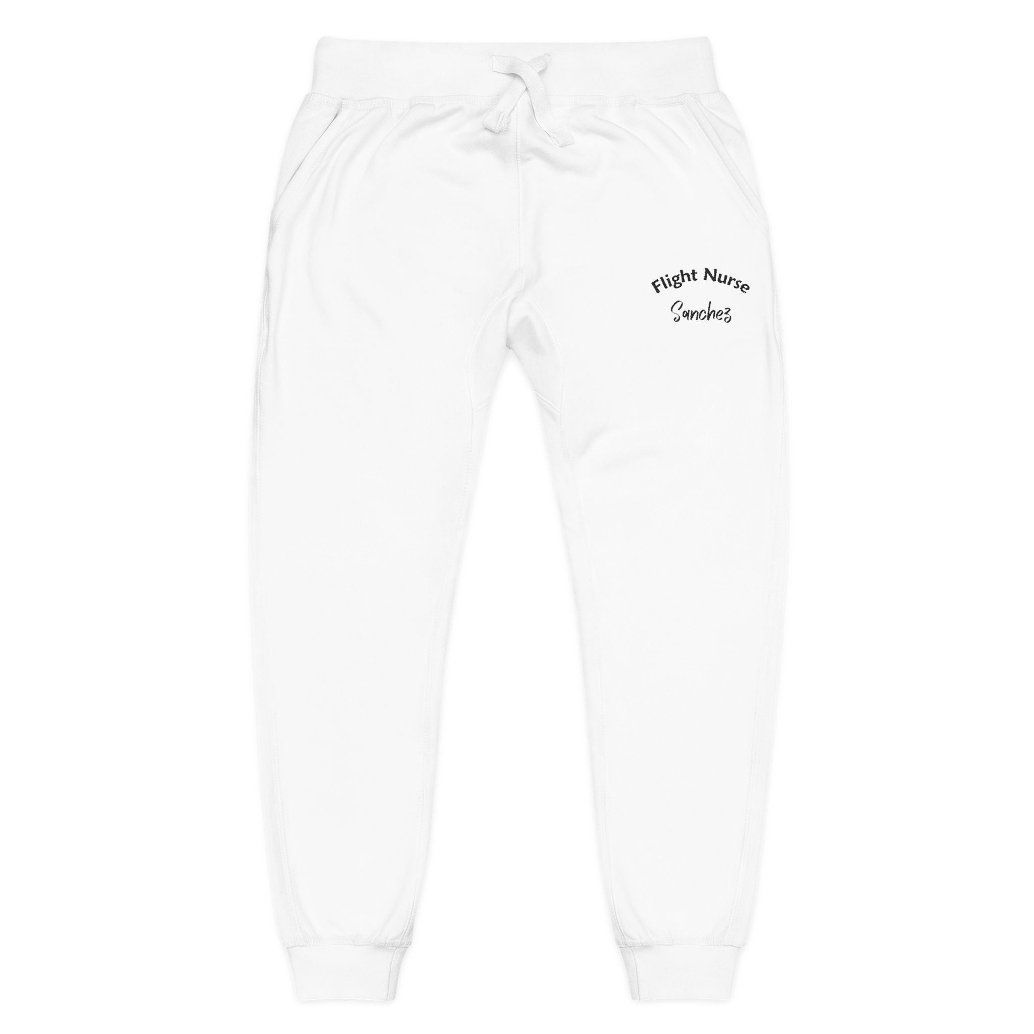 White joggers with embroidered 'Flight Nurse Sanchez' text on the thigh against a white background