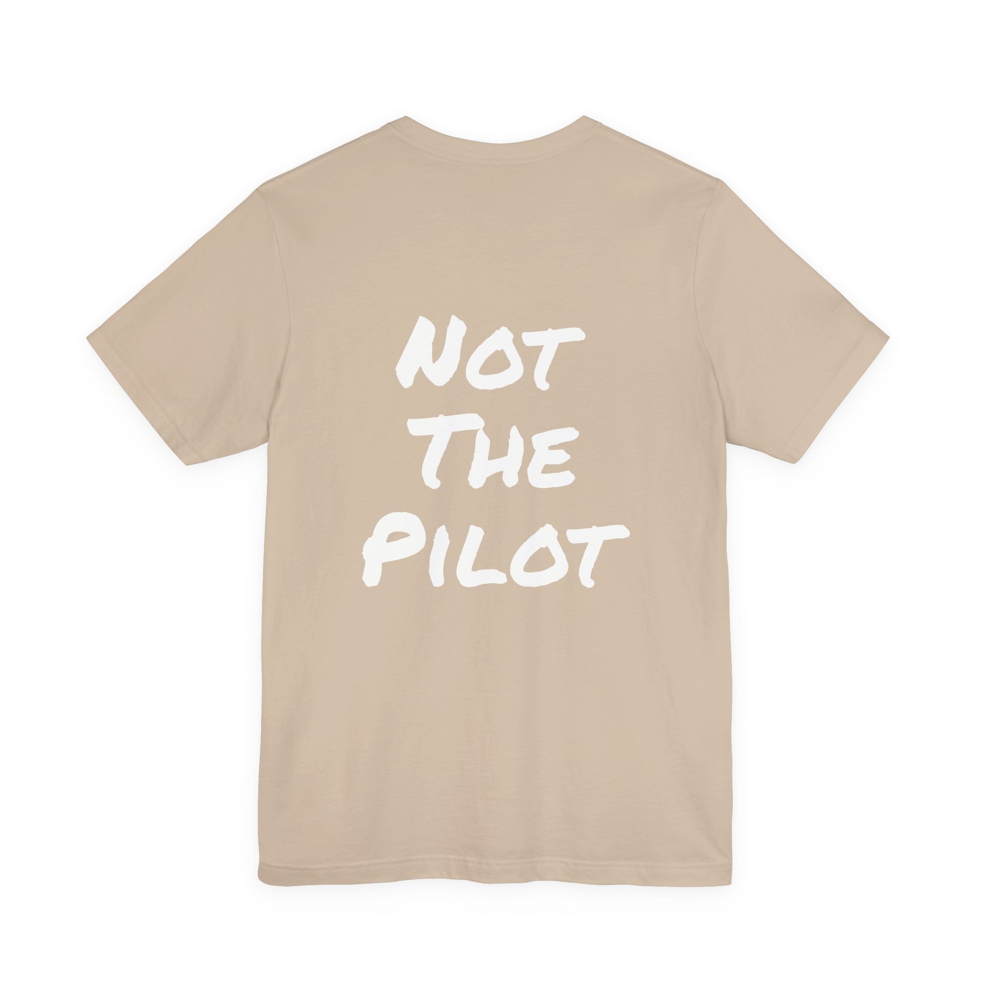 Beige t-shirt with 'NOT THE PILOT' text on a white background