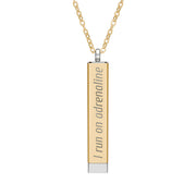 Silver and gold two-toned necklace with a cylindrical pendant engraved with 'I run on adrenaline' with hidden interior engraving "and spite" by Rotor Wash & Wear