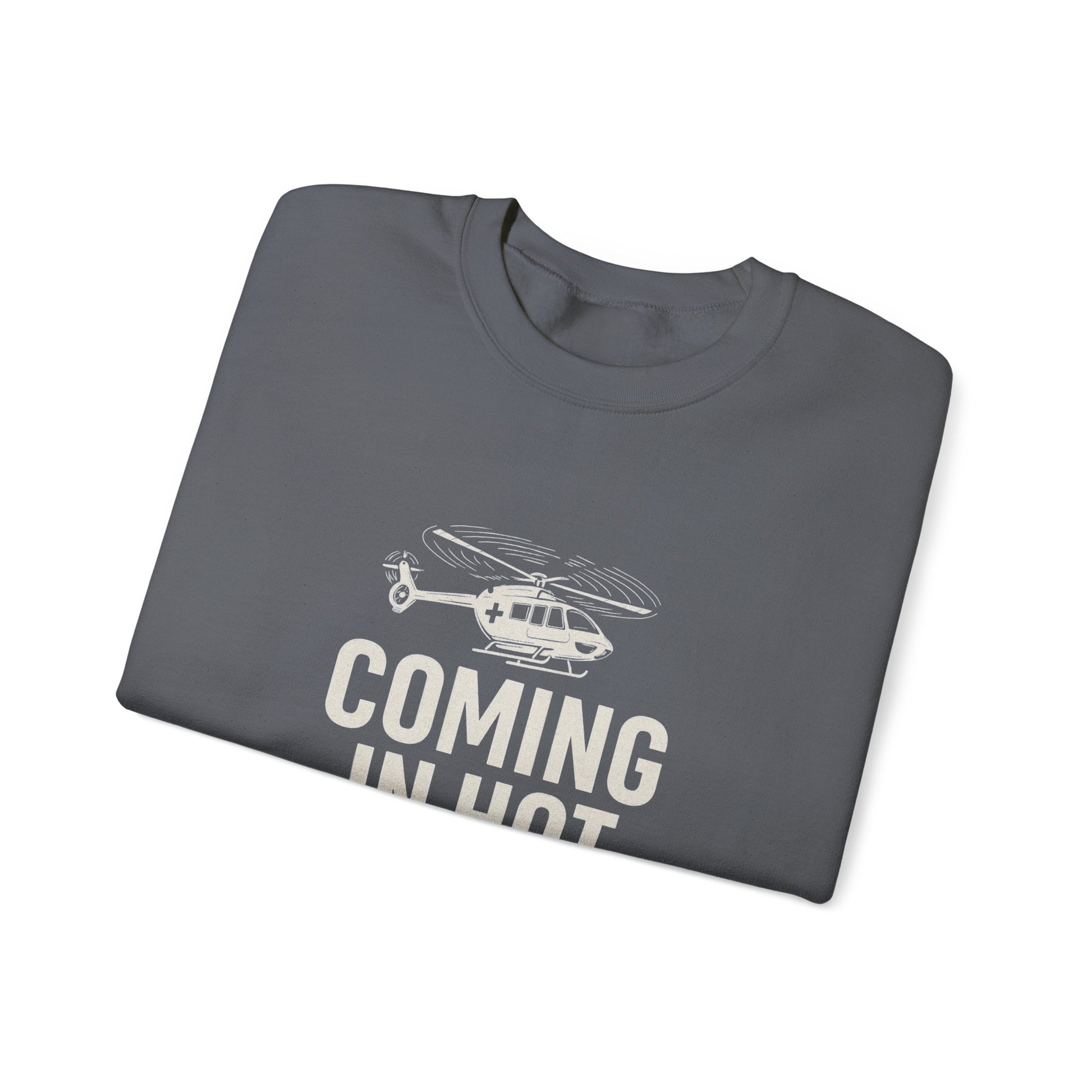 Folded gray sweatshirt with helicopter graphic and text 'COMING IN HOT' by Rotor Wash & Wear