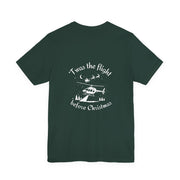 Green t-shirt with white helicopter graphic in the snow with Santa and his sleigh in the background and text "'Twas the flight before Christmas" by Rotor Wash & Wear