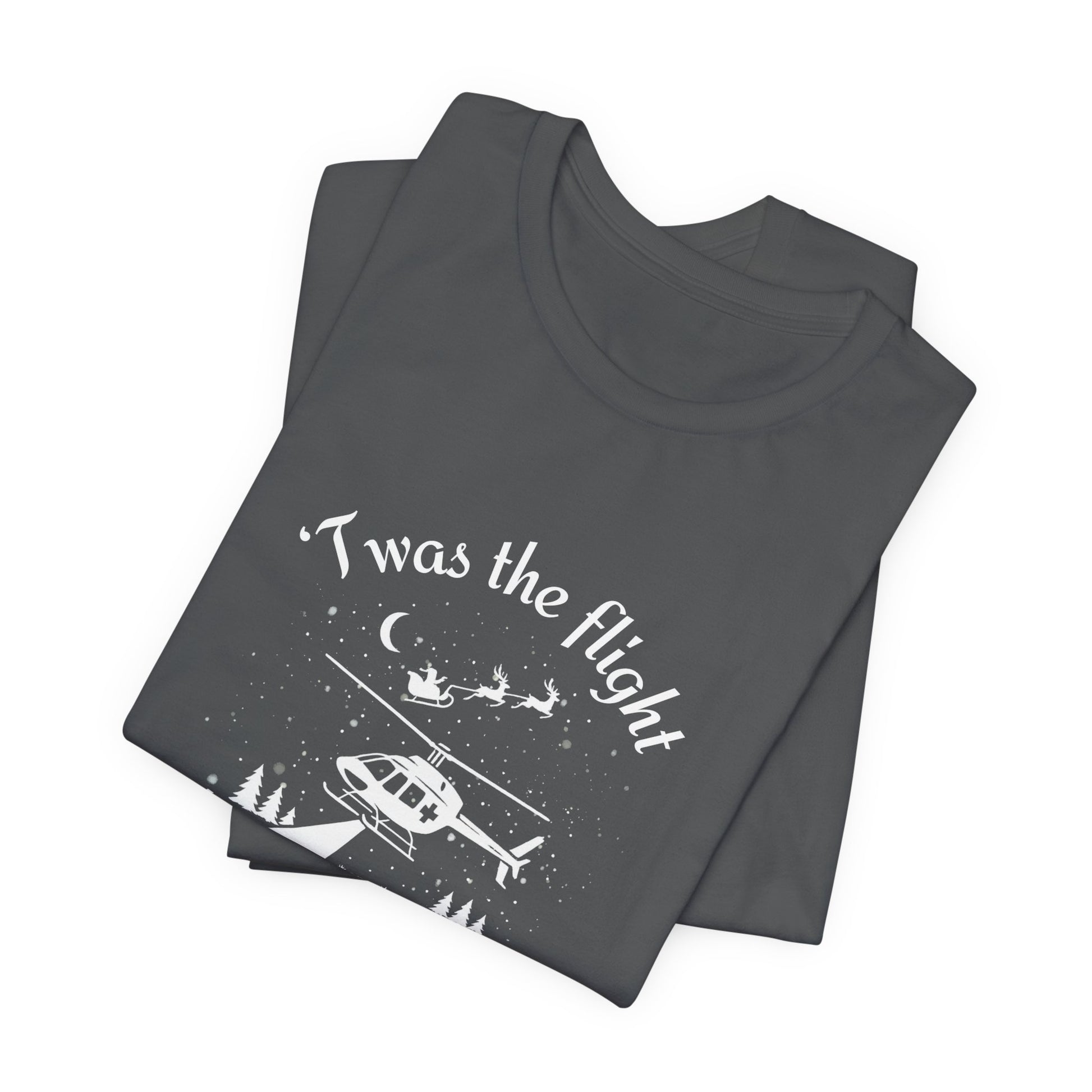 Folded gray t-shirt with helicopter graphic and Santa and his sleigh in the background with text "'Twas the flight before Christmas" by Rotor Wash & Wear