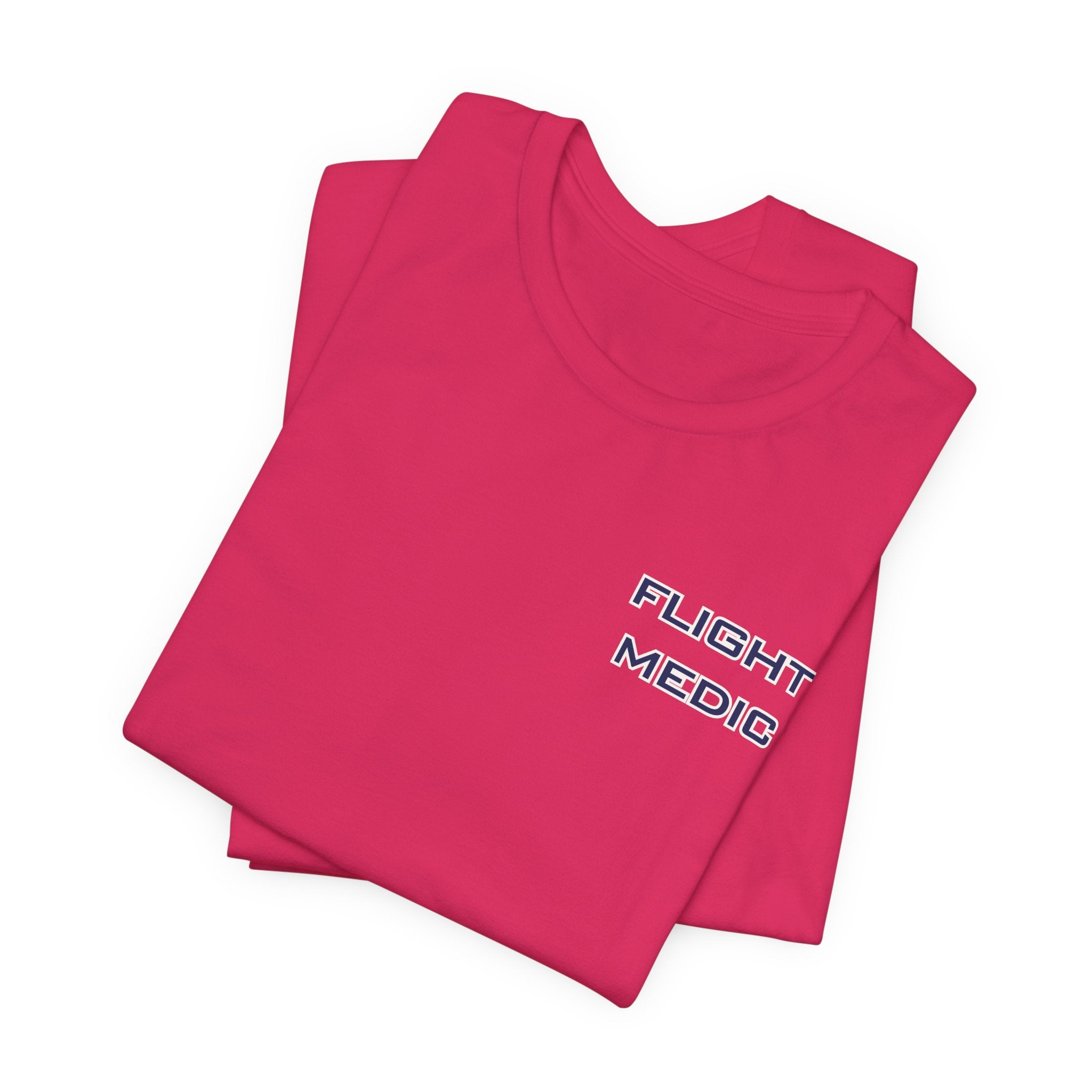 Folded pink t-shirt with text 'Flight Medic' on the left chest by Rotor Wash & Wear