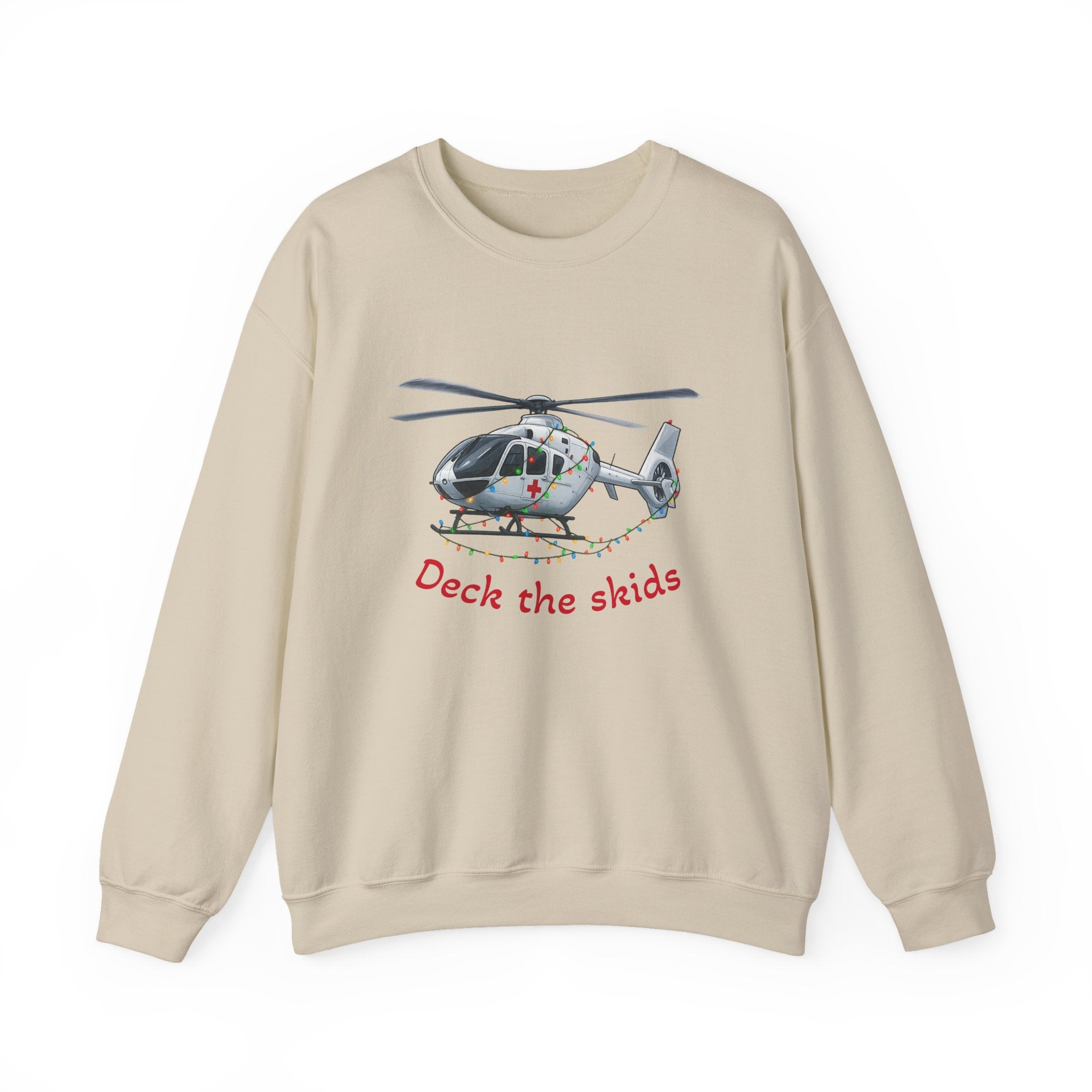 Beige sweatshirt with a medical helicopter graphic wrapped in Christmas lights and text "deck the skids" by Rotor Wash & Wear