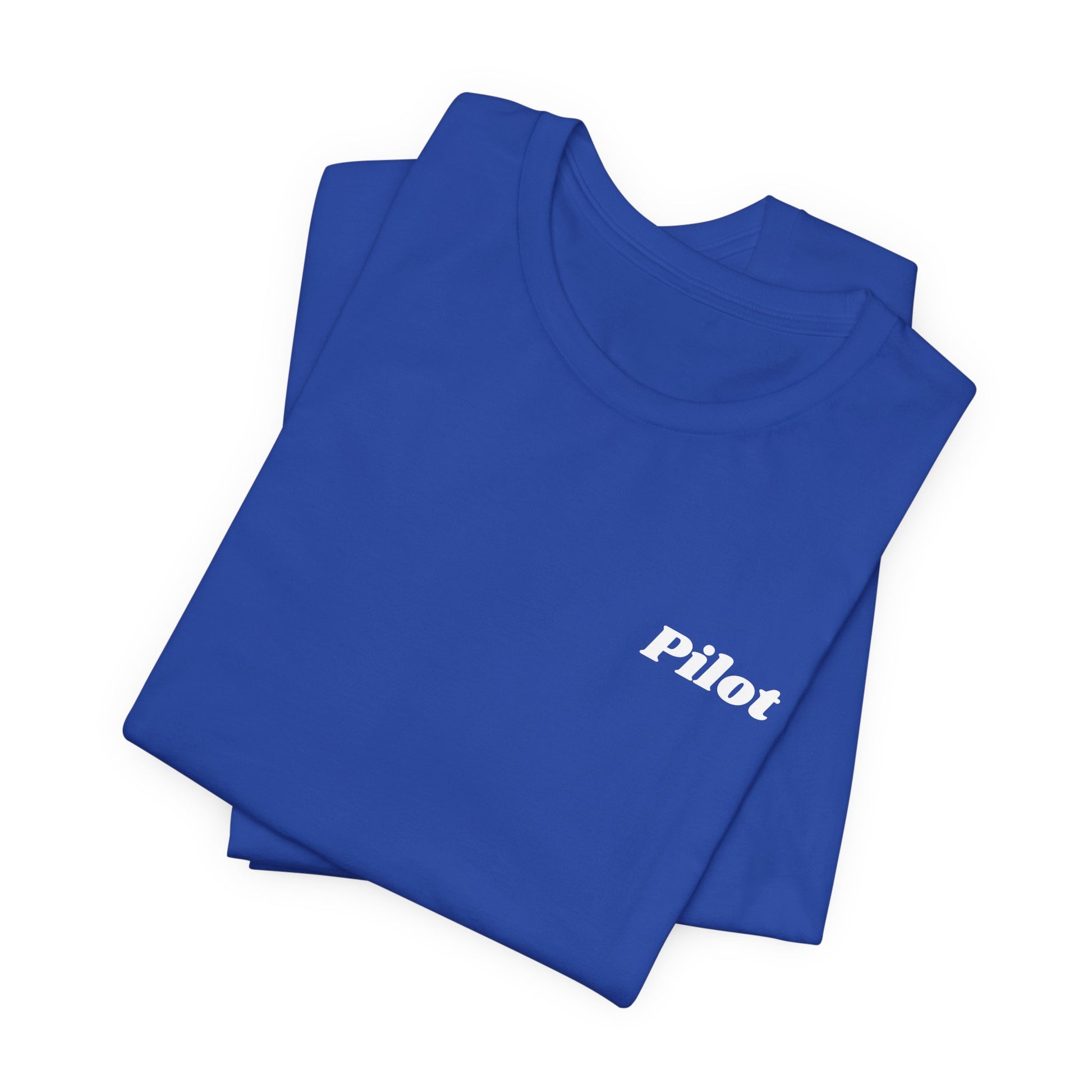 Folded blue t-shirt with 'Pilot' text on a white background