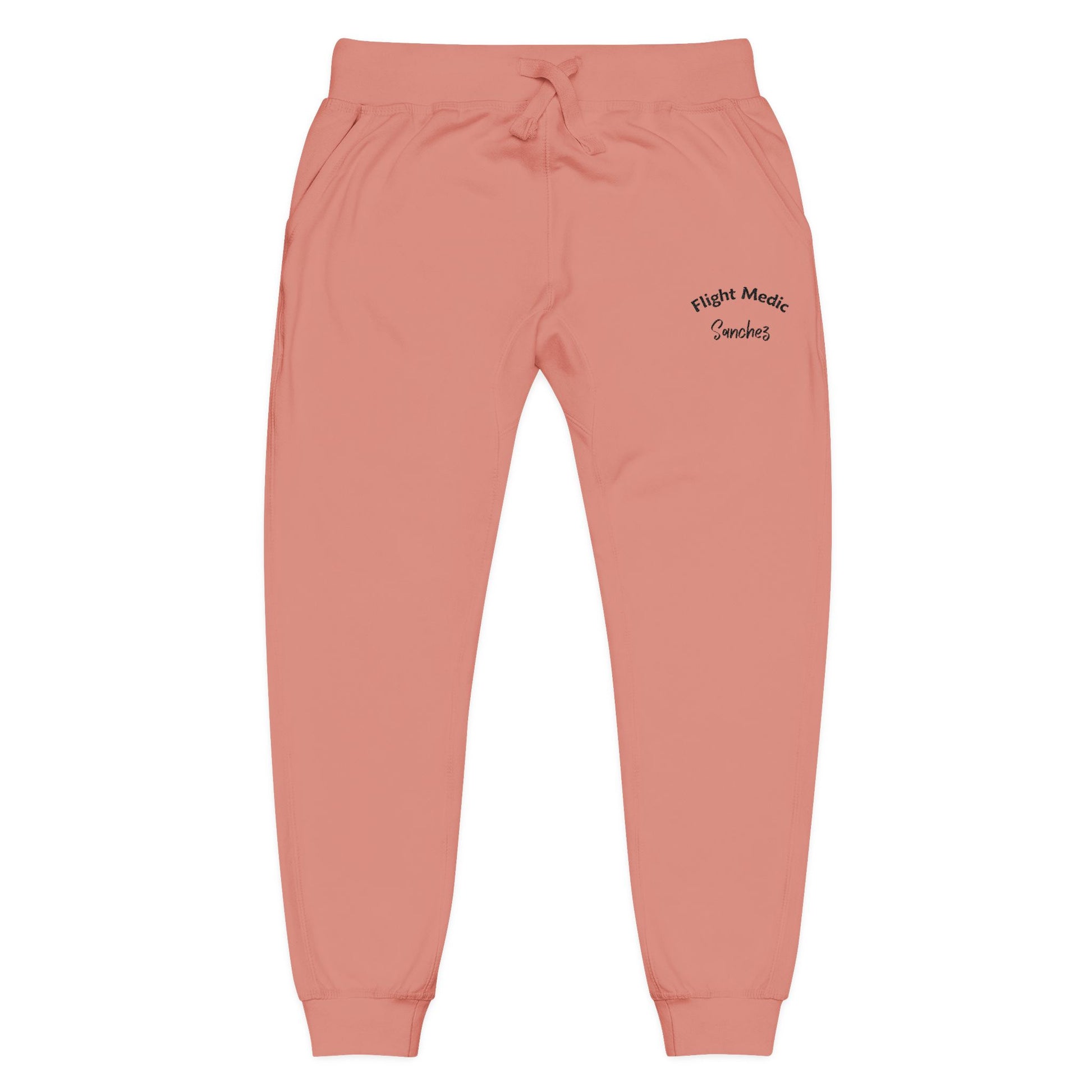 Pink joggers with text "Flight Medic Sanchez" on a white background