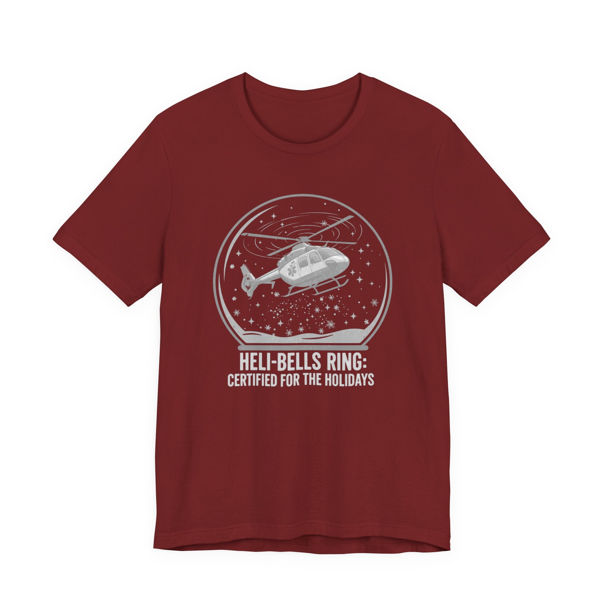 Dark red t-shirt with a graphic of a helicopter in a snow globe and text "Heli-bells ring: certified for the holidays" by Rotor Wash & Wear