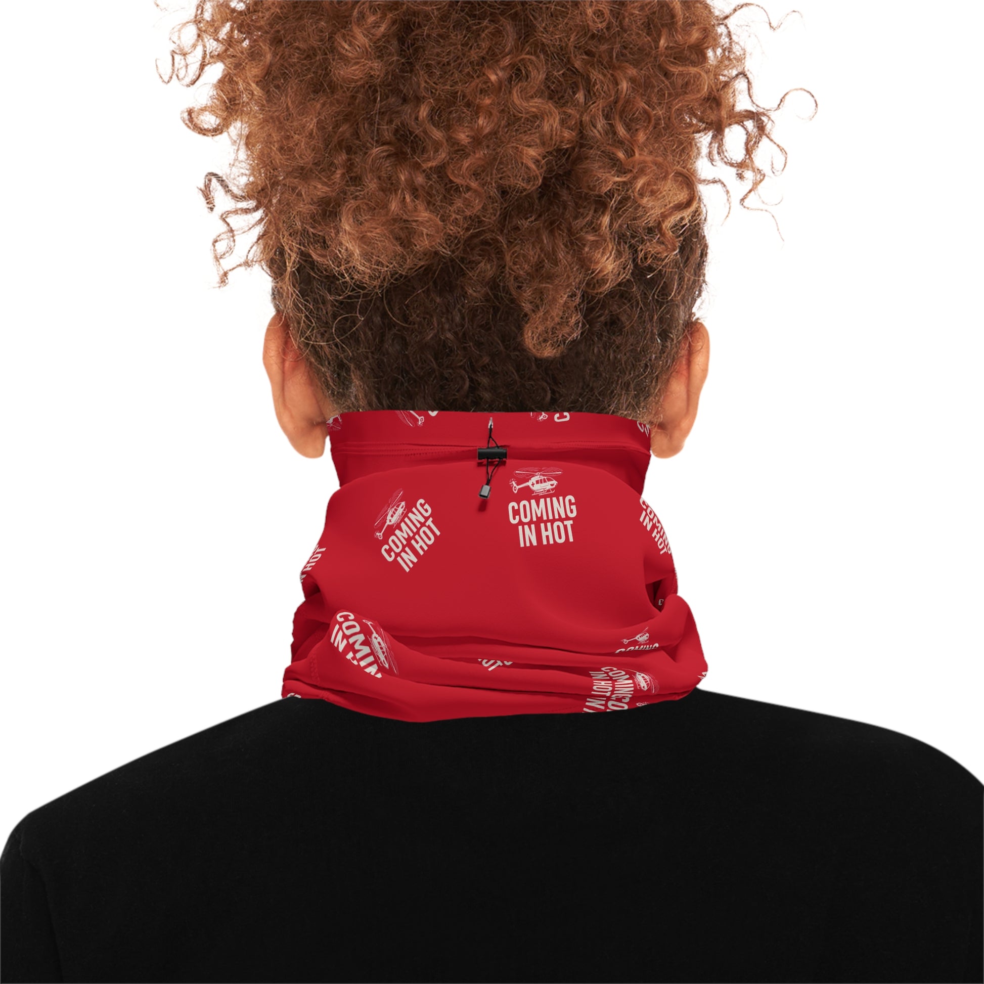 Person wearing red neck gaiter with text "Coming in hot" with a helicopter graphic by Rotor Wash & Wear