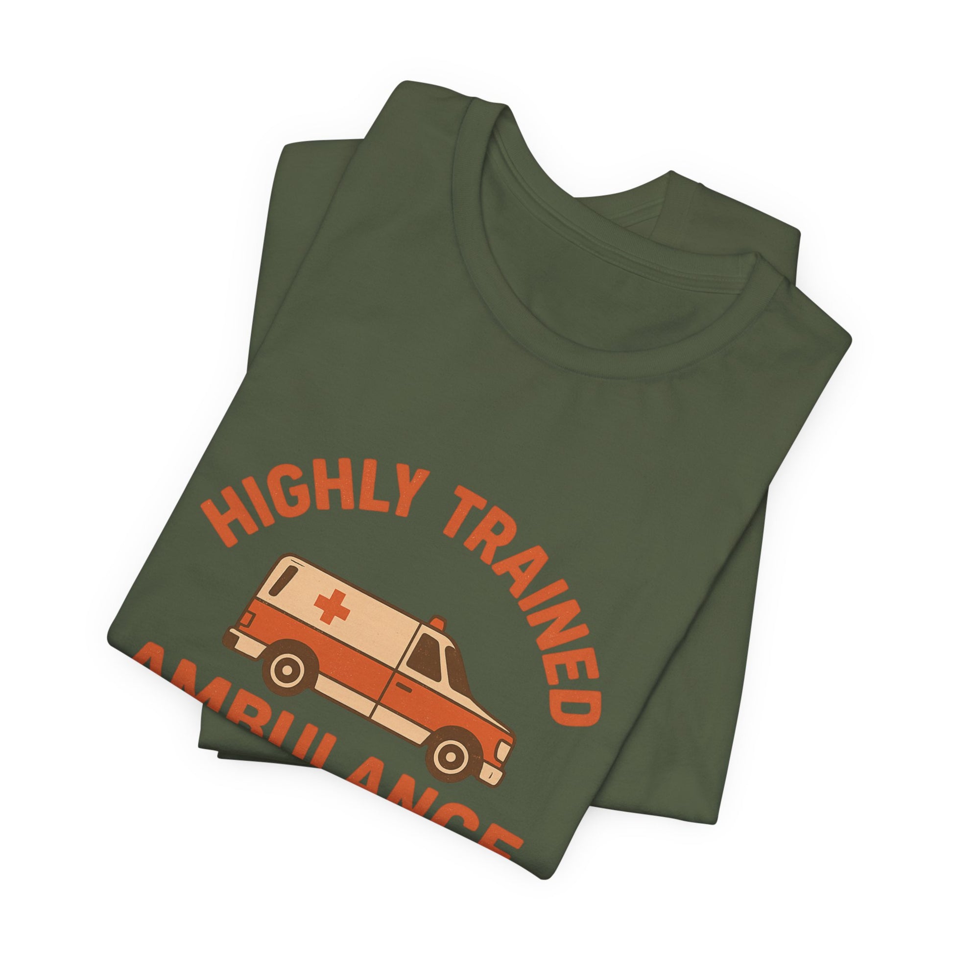 Folded green t-shirt with 'Highly Trained ambulance driver' and ambulance graphic on a white background