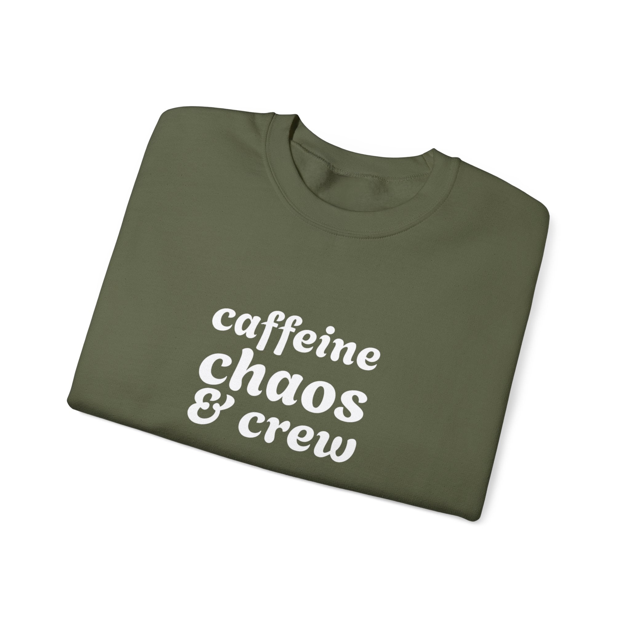 Folded green sweatshirt with 'caffeine chaos & crew' text on by Rotor Wash & Wear