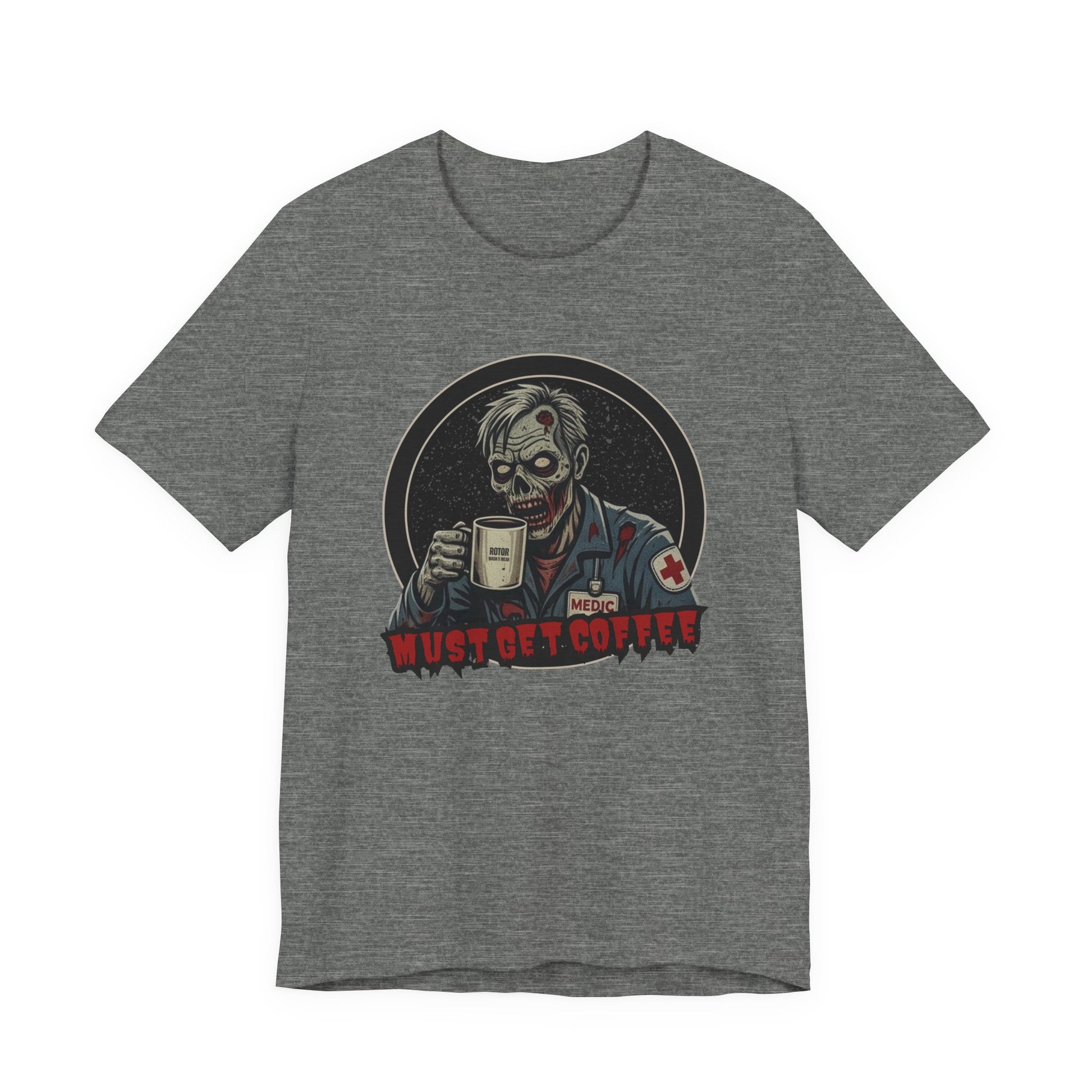 A heather gray crewneck t-shirt featuring a graphic of a zombie medic holding a coffee mug with the text 'MUST GET COFFEE!' in red by Rotor Wash & Wear