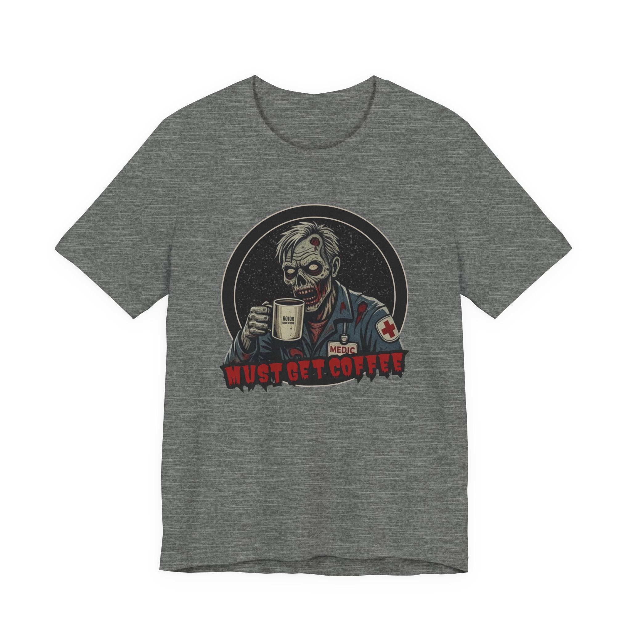 A heather gray crewneck t-shirt featuring a graphic of a zombie medic holding a coffee mug with the text 'MUST GET COFFEE!' in red by Rotor Wash & Wear