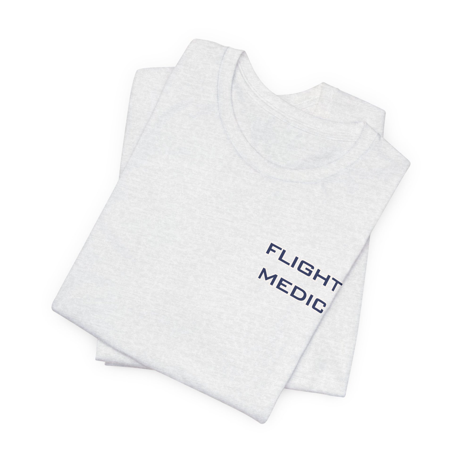 Folded white t-shirt with text 'Flight Medic' on the left chest by Rotor Wash & Wear