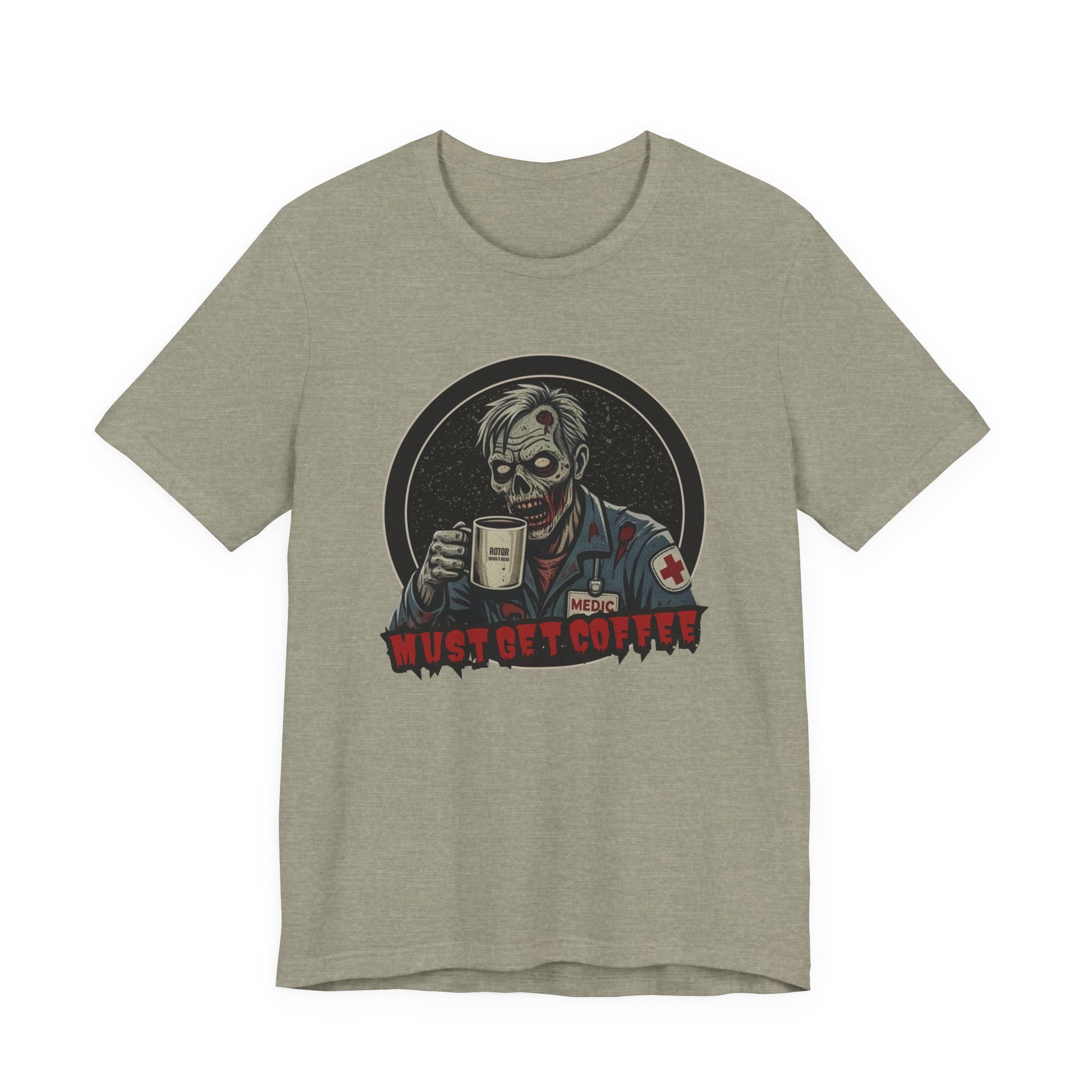 A heather gray crewneck t-shirt featuring a graphic of a zombie medic holding a coffee mug with the text 'MUST GET COFFEE!' in red by Rotor Wash & Wear