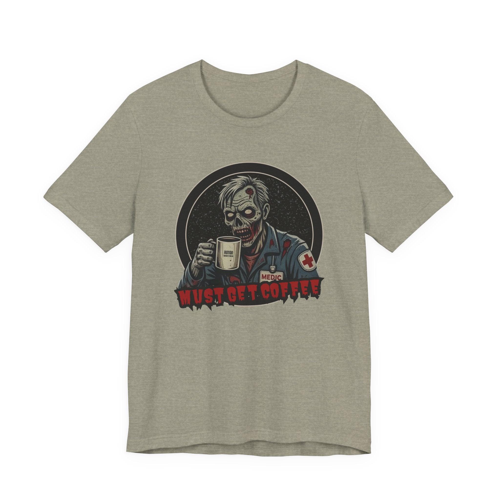 A heather gray crewneck t-shirt featuring a graphic of a zombie medic holding a coffee mug with the text 'MUST GET COFFEE!' in red by Rotor Wash & Wear